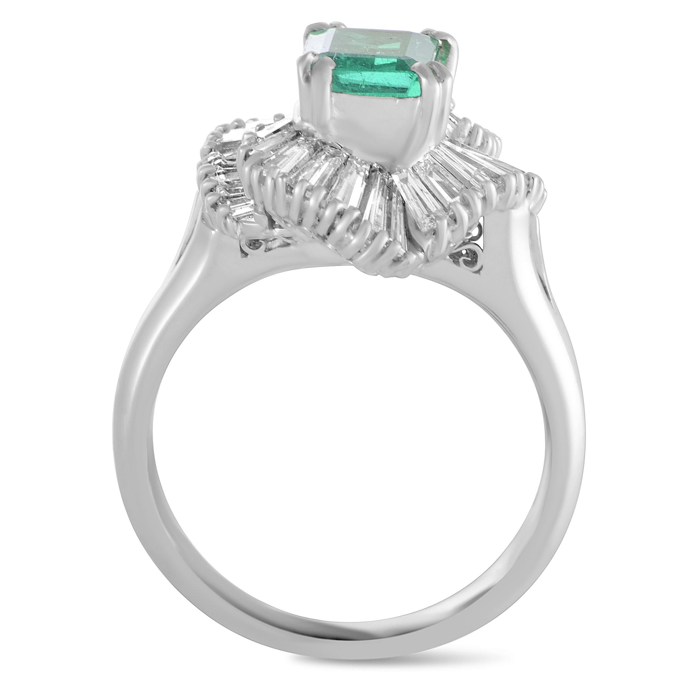 Elevate your style in a compellingly luxurious manner with this fabulous ring that is exquisitely crafted from prestigious platinum and splendidly embellished with an emerald and a plethora of incredibly resplendent diamonds. The emerald weighs 0.94