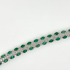 Platin-Tennisarmband aus Platin mit Smaragden im Ovalschliff und Diamanten