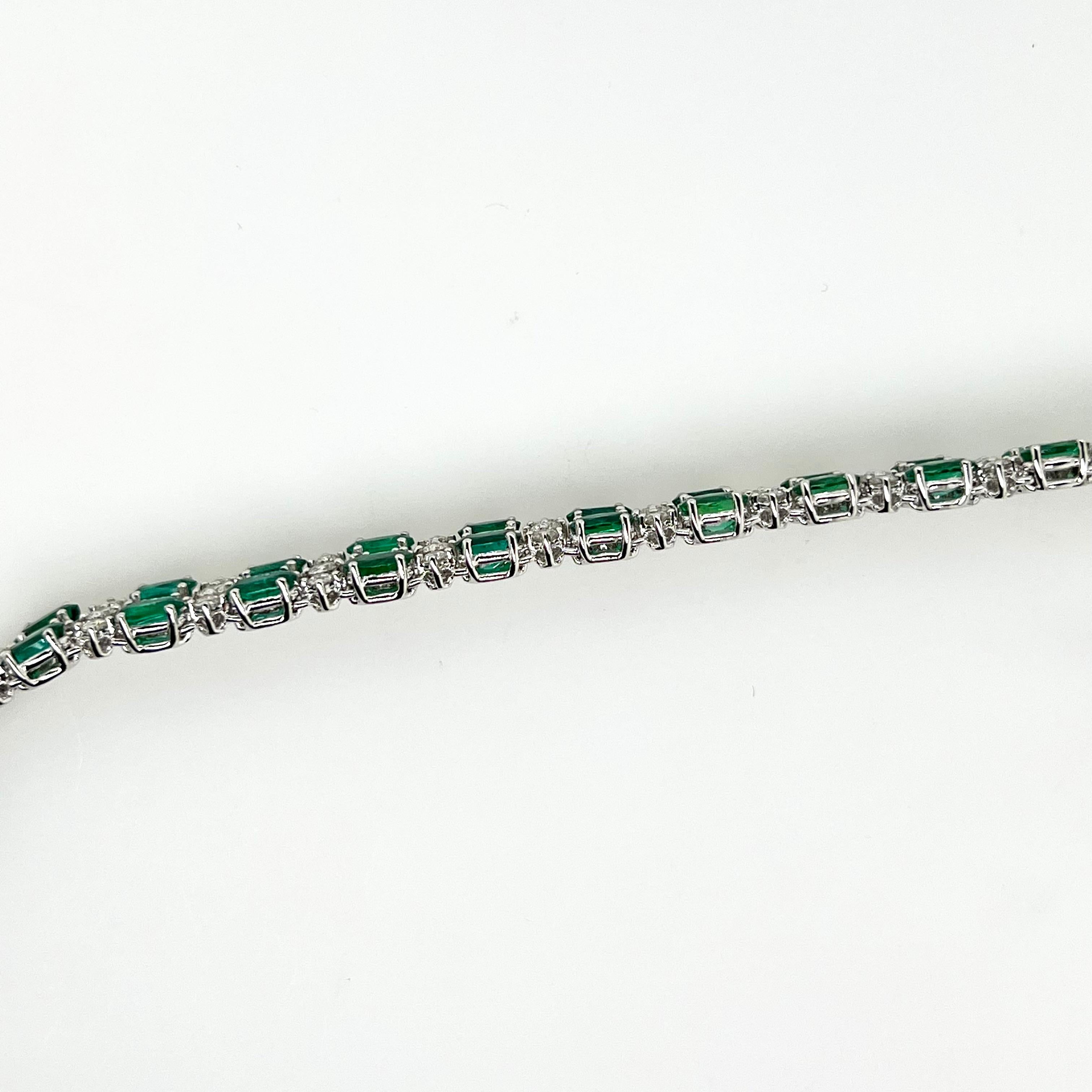 Contemporary Platinum Tennis Bracelet with Oval Cut Emeralds and Diamonds For Sale
