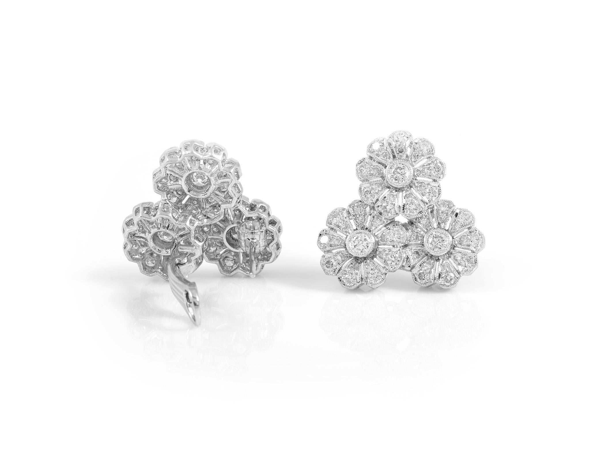 The earrings are finely crafted in platinum with diamonds weighing approximately total of 4.28 carat.