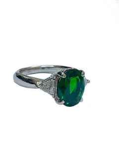 Platinum Three Stone Diamond 2.42 Carat Oval Tsavorite Garnet Engagement Ring
