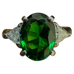 Platinum Three Stone Diamond 2.42 Carat Oval Tsavorite Garnet Engagement Ring