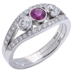 Platinum three - stone diamond and ruby ring