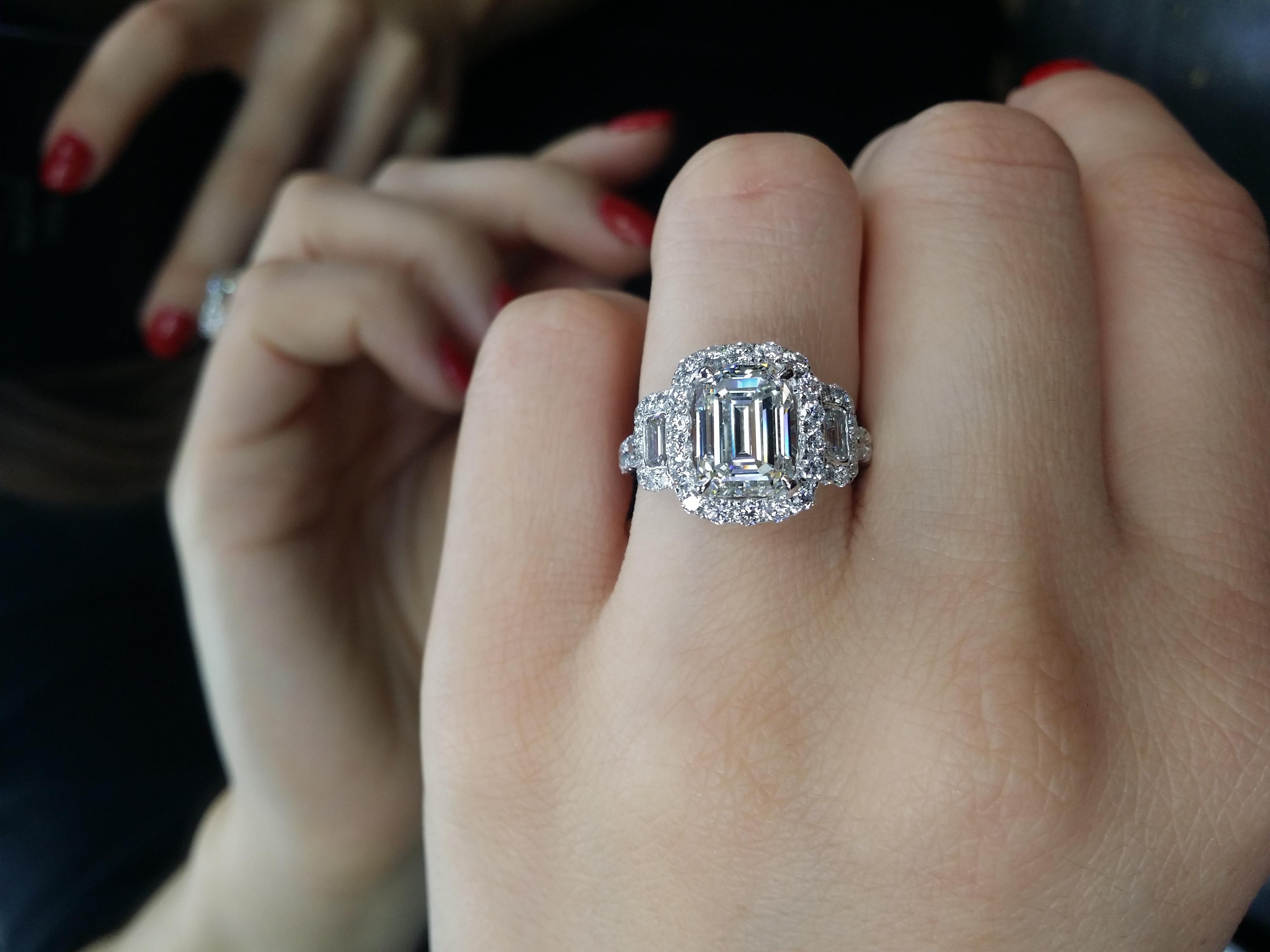Platinum emerald cut diamond engagement ring, features 3.19 Carats of Diamonds, I in color SI1 in clarity. Set with two baguettes on the side totaling 1.50 Carats of diamonds. 
CERTIFIED BY GIA