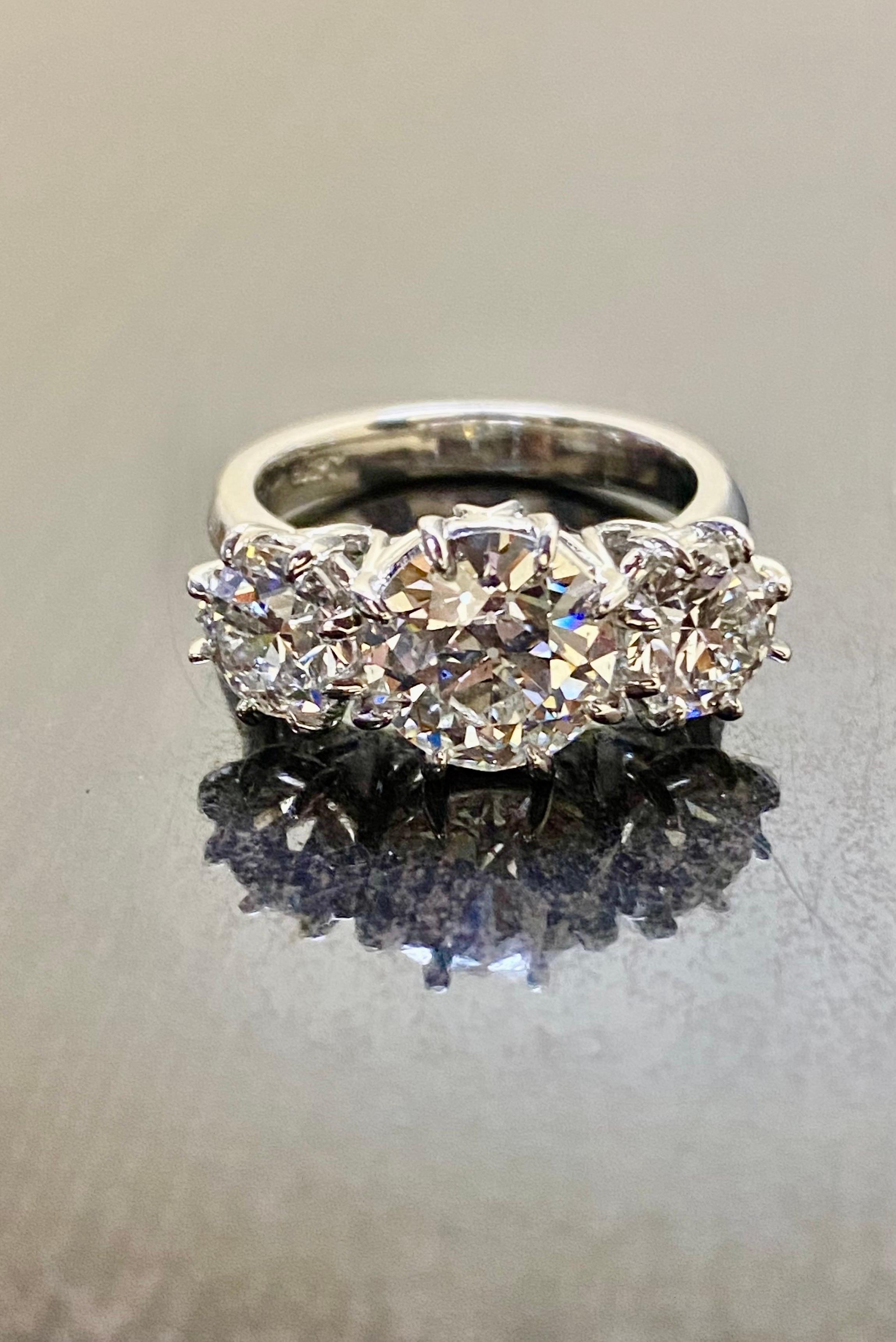 Platinum Three Stone GIA 4.28 Carat Old European Diamond Engagement Ring For Sale 5