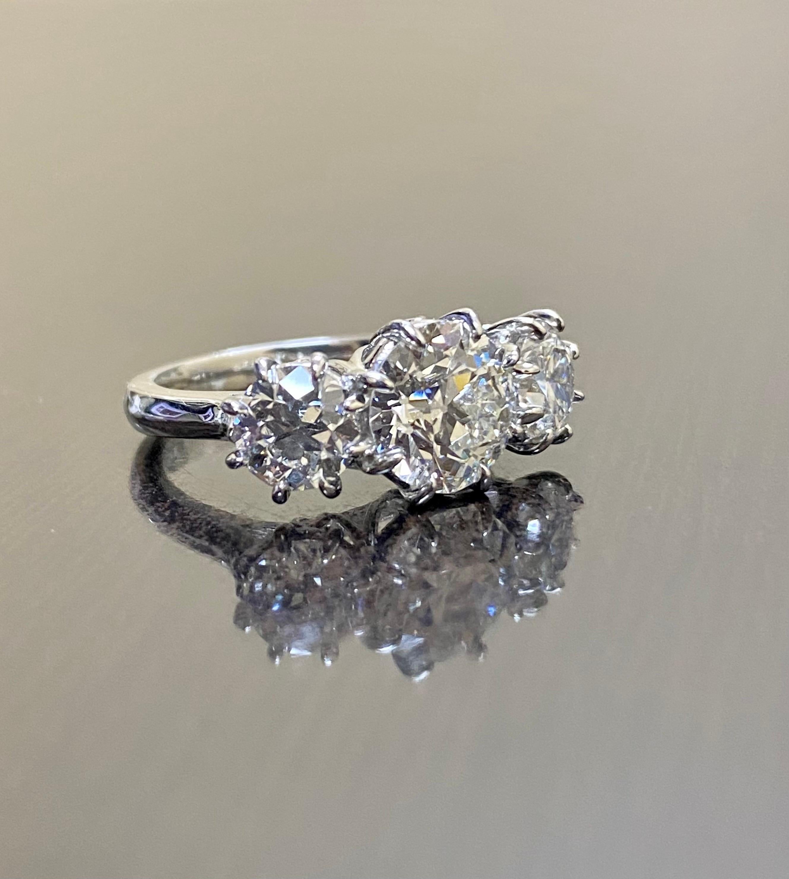 Women's Platinum Three Stone GIA 4.28 Carat Old European Diamond Engagement Ring For Sale