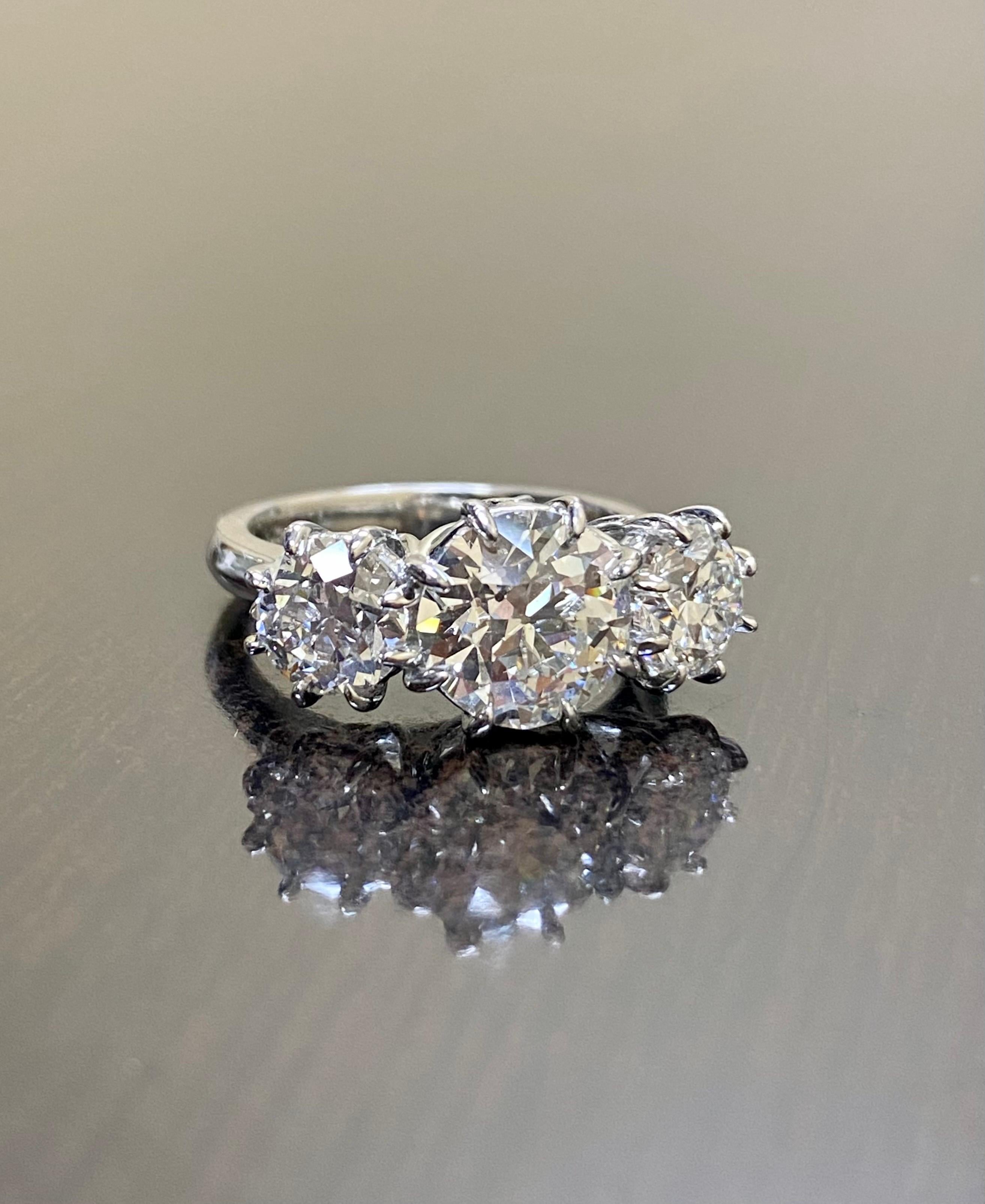 Platinum Three Stone GIA 4.28 Carat Old European Diamond Engagement Ring For Sale 1