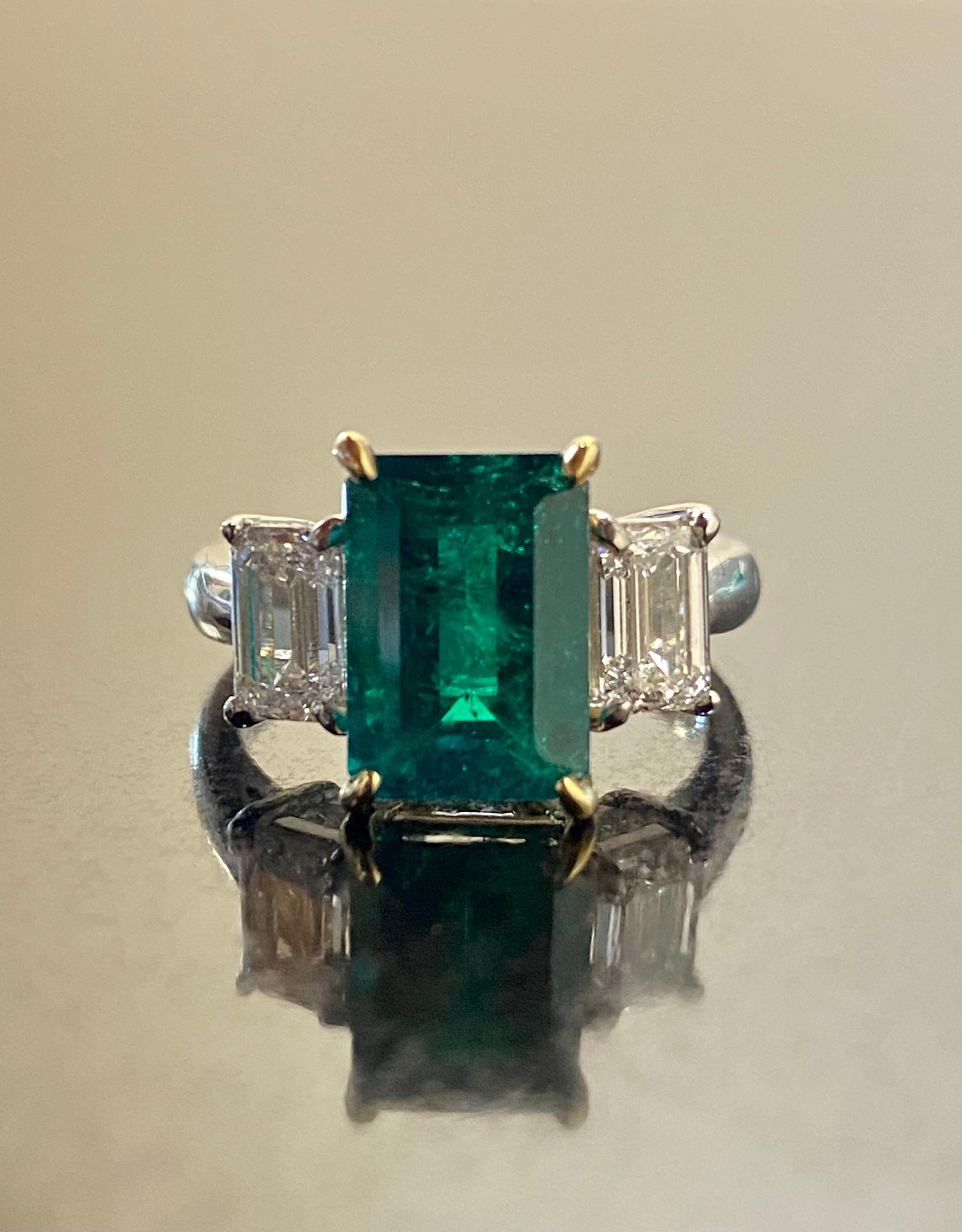 Art Deco Platinum Three Stone GIA Emerald Cut Diamond Colombian Emerald Engagement Ring For Sale