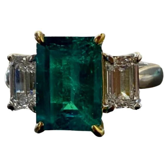Platinum Three Stone GIA Emerald Cut Diamond Colombian Emerald Engagement Ring