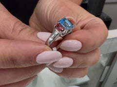 Platinum Three Stone Pink Tourmaline 0.75 Carat and Blue Topaz 1.35 Carat Ring