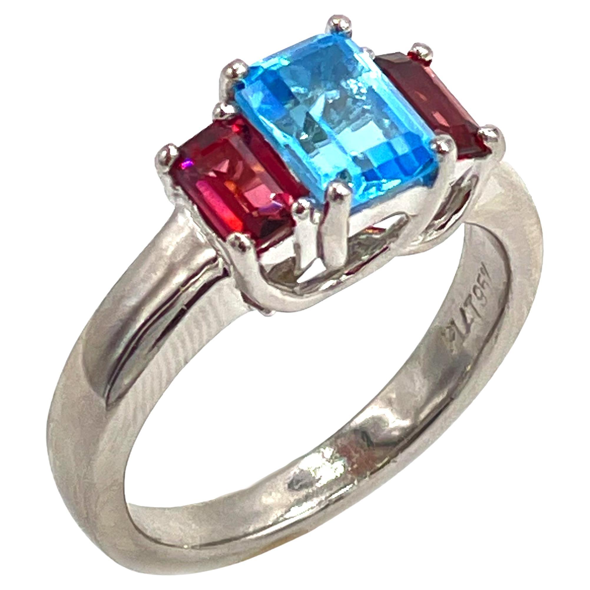 Platinum Three Stone Pink Tourmaline and Blue Topaz Ring For Sale
