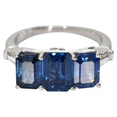 Platinum Three Stone Ring with Blue Emerald Cut Sapphire
Diamonds - Size 5.75