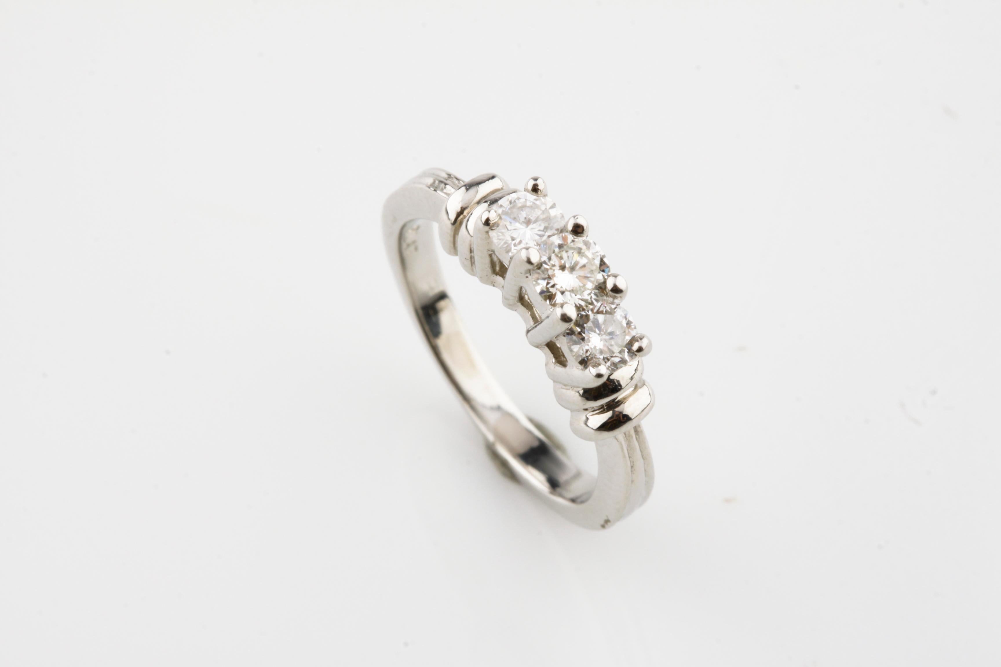 Gorgeous Three Stone Ring
Total Diamond Weight = 0.40 ct
Size 3.75
Total Mass = 5.0 grams