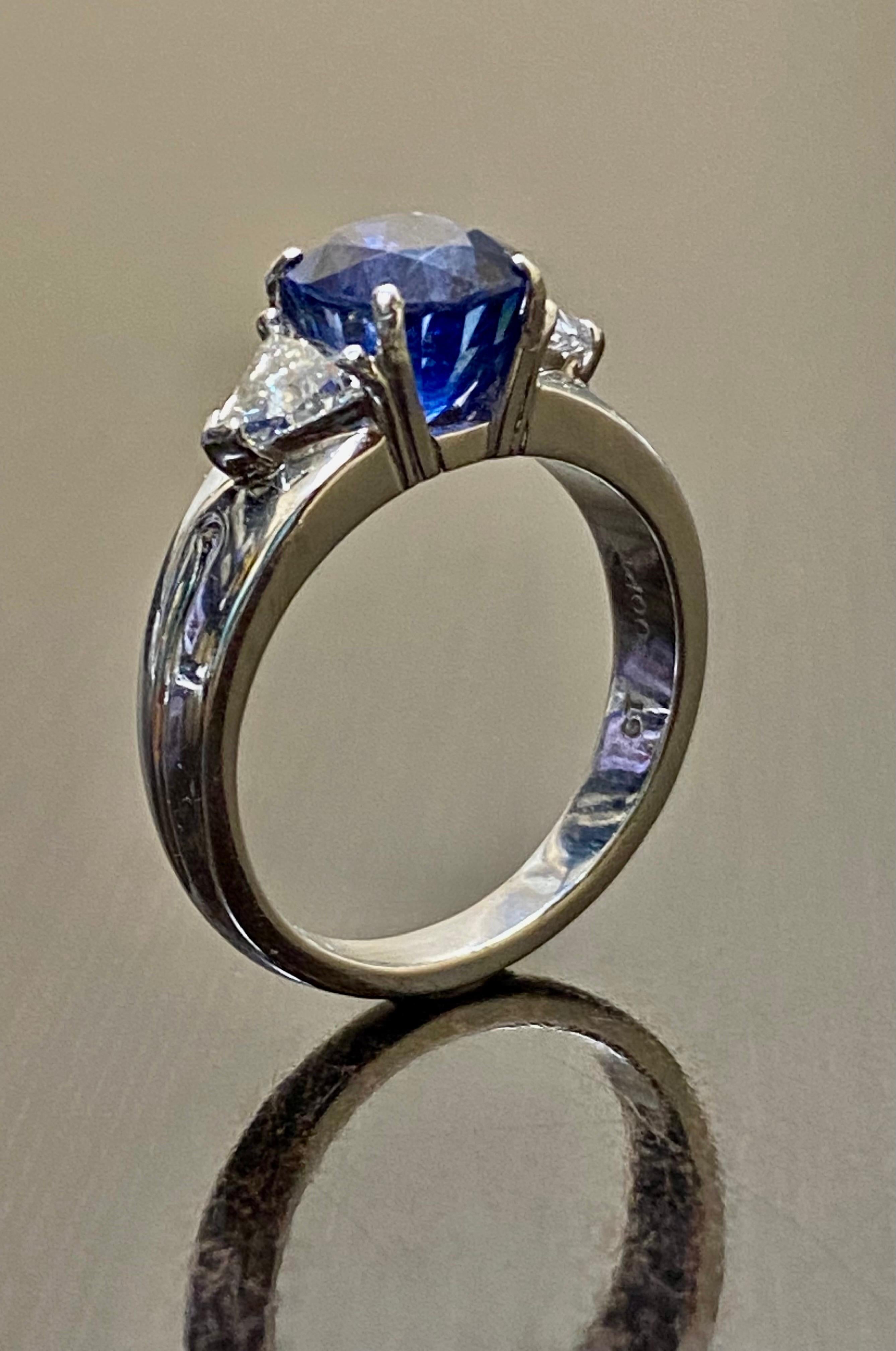 DeKara Designs Collection

Beautiful Modern/Art Deco Ceylon/Sri Lanka Blue Sapphire and Trillion Diamond Three Stone Ring

Metal- 90% Platinum, 10% Iridium

Stones- Genuine Oval Ceylon/Sri Lanka Royal Blue Sapphire 4.10 Carats. Two Trillion Cut