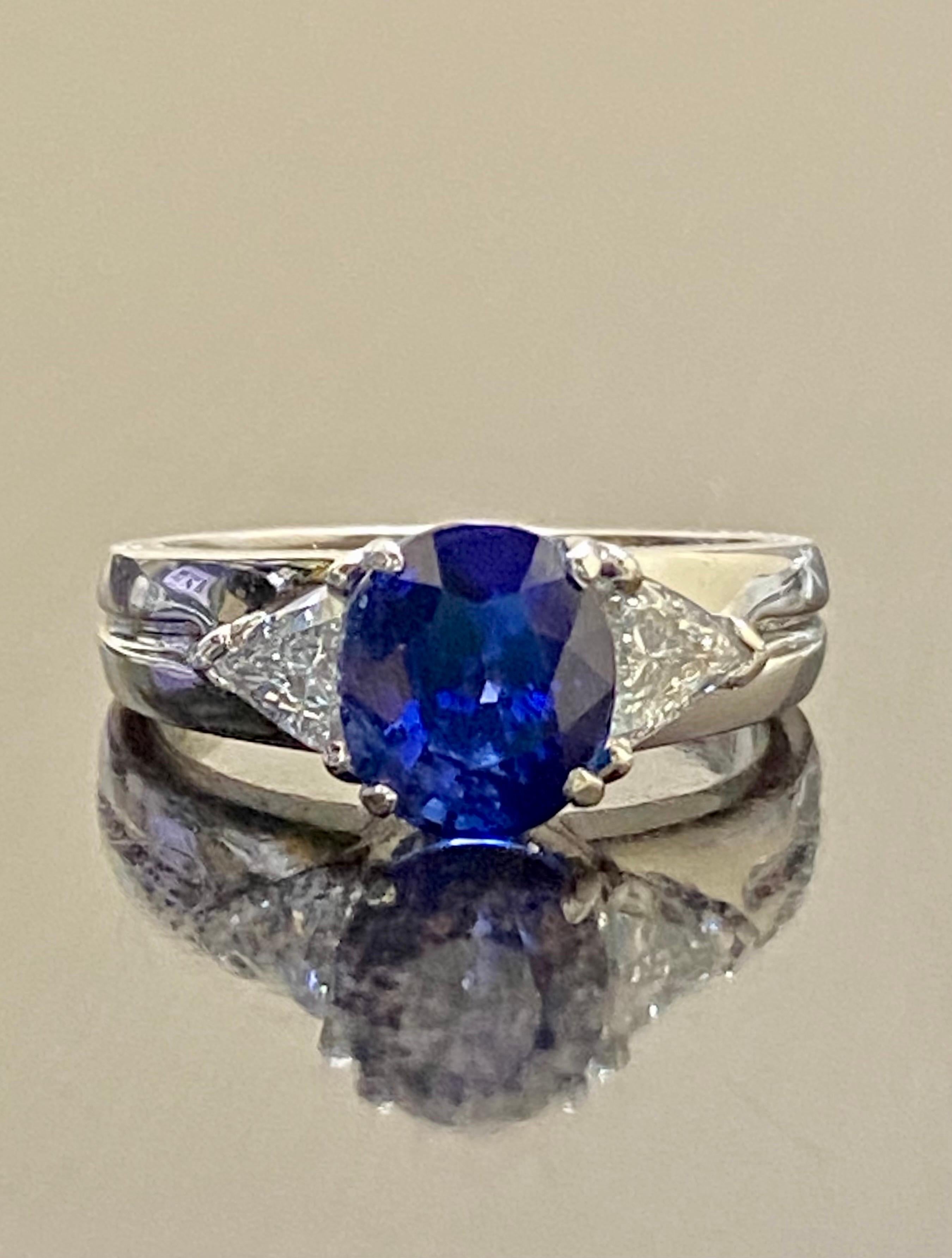 Modern Platinum Three Stone Trillion Diamond 4.10 Carat Blue Sapphire Engagement Ring For Sale