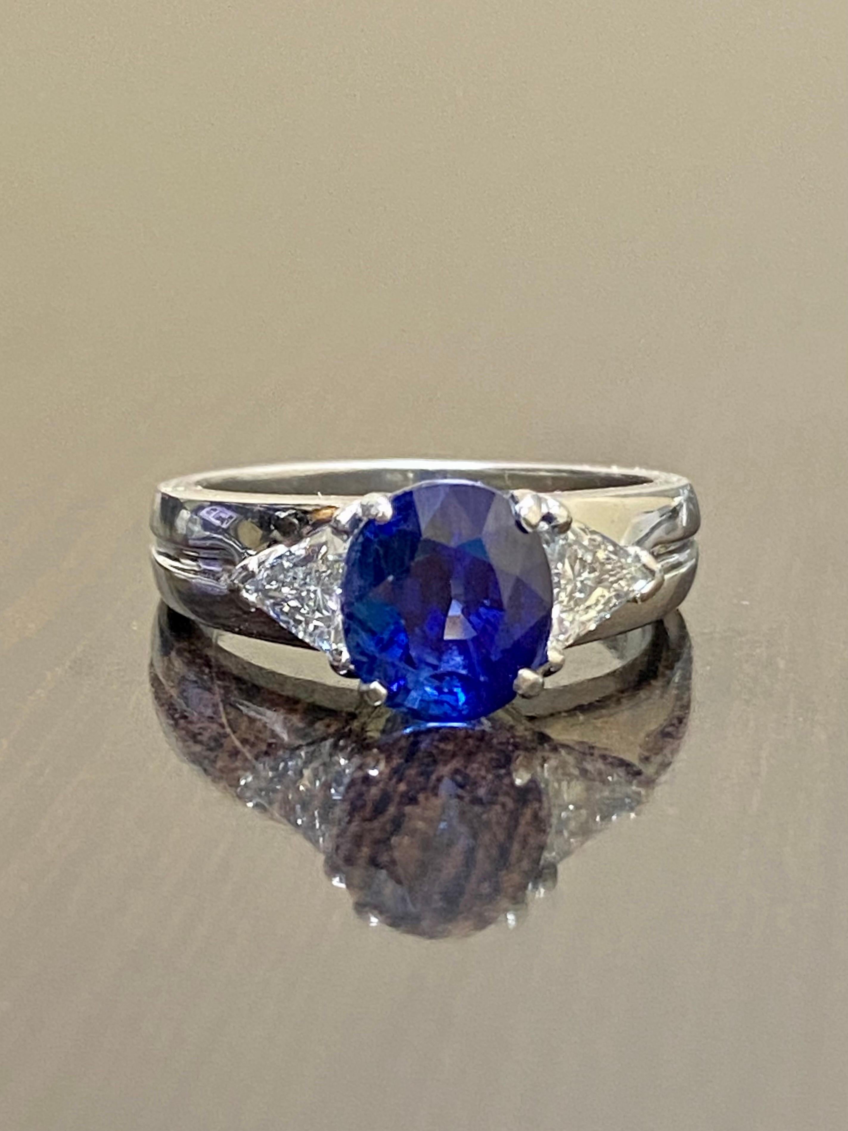 Platinum Three Stone Trillion Diamond 4.10 Carat Blue Sapphire Engagement Ring In New Condition For Sale In Los Angeles, CA