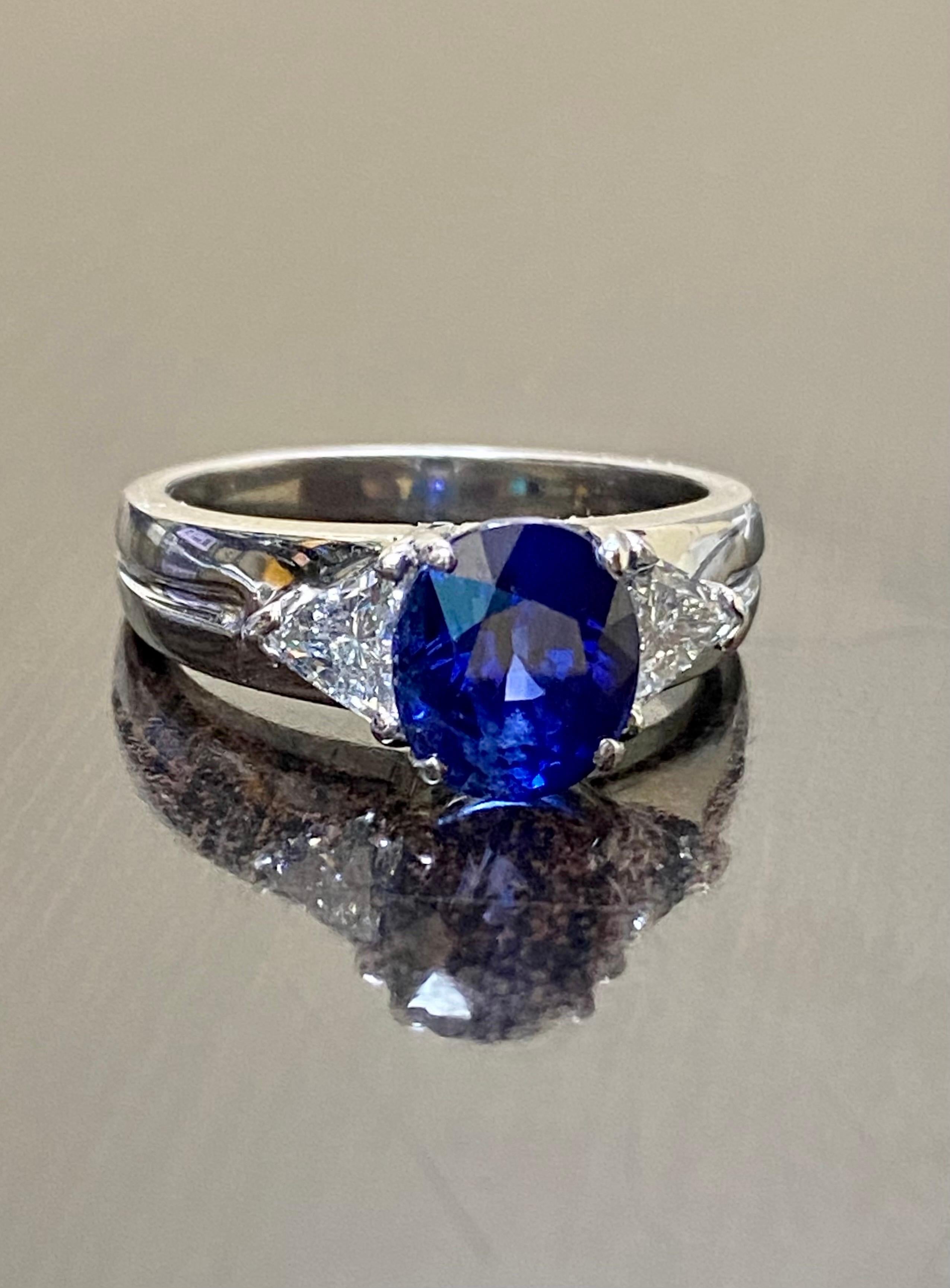 Women's or Men's Platinum Three Stone Trillion Diamond 4.10 Carat Blue Sapphire Engagement Ring For Sale
