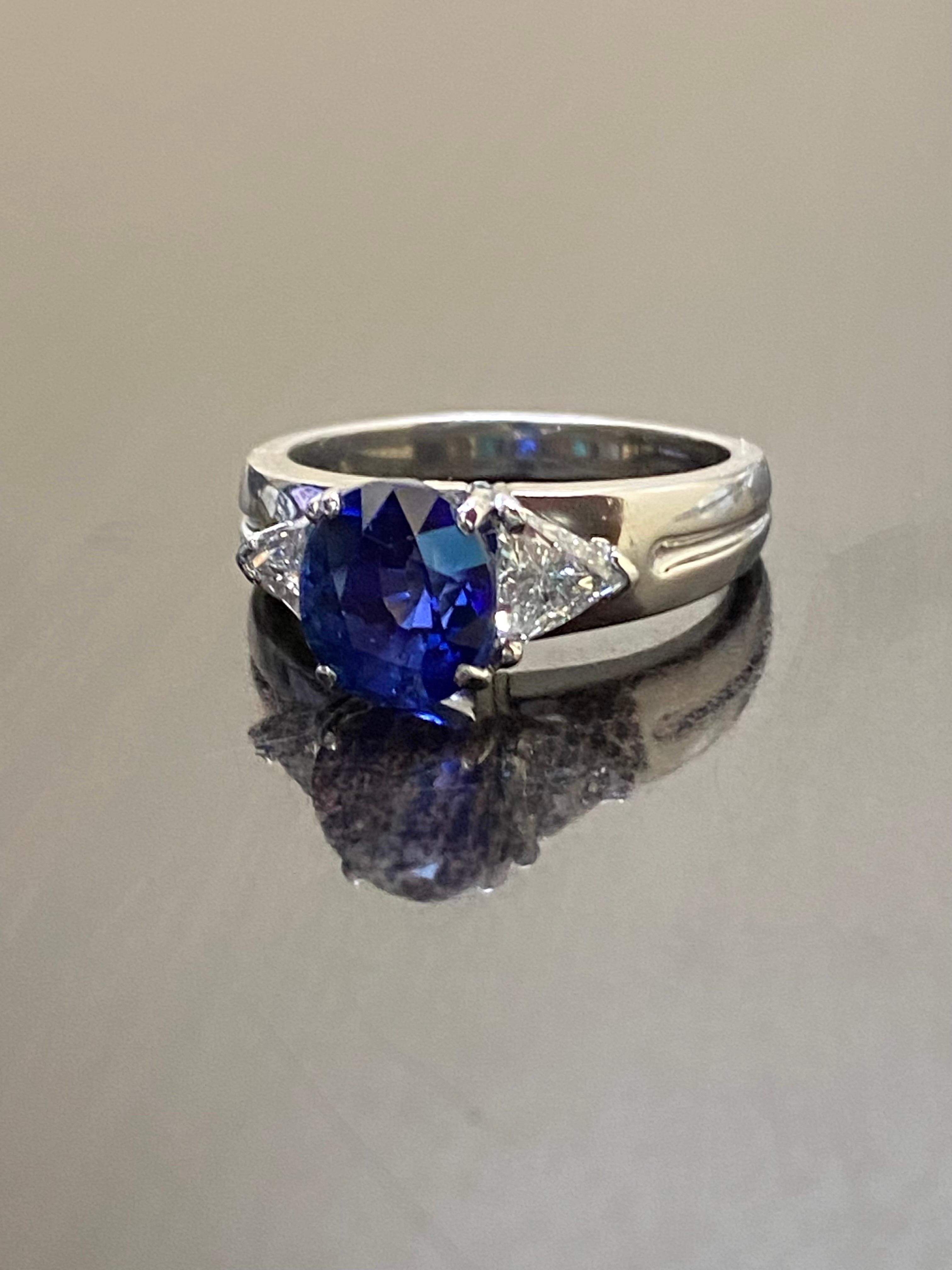 Platinum Three Stone Trillion Diamond 4.10 Carat Blue Sapphire Engagement Ring For Sale 1