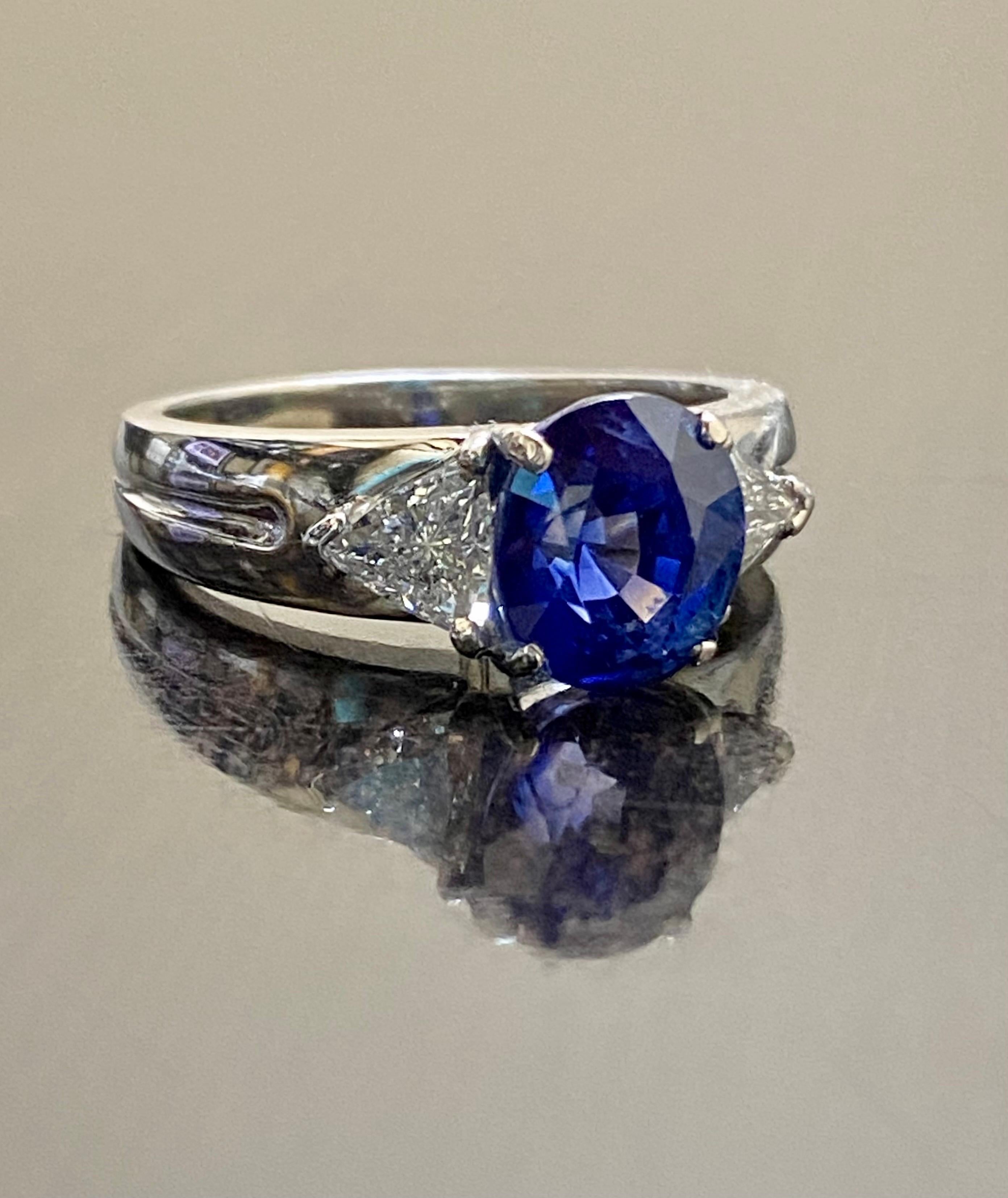 Platinum Three Stone Trillion Diamond 4.10 Carat Blue Sapphire Engagement Ring For Sale 2