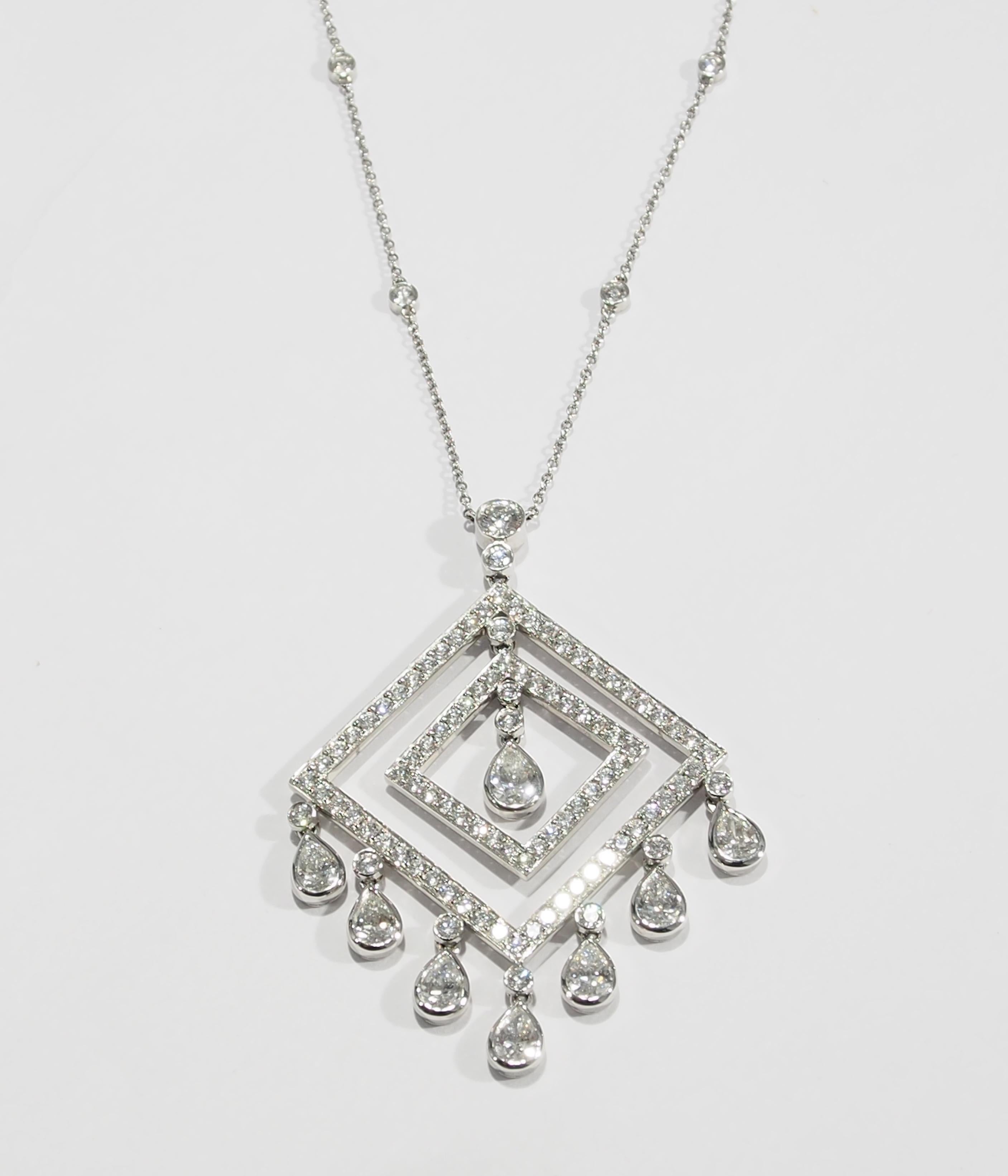From the iconic jewelry designer, Tiffany & Co. is this stunning vintage Platinum Diamond Pendant. The Pendant is fashioned in a geometric style with (2) concentric Squares that have (8) Pear Shape Diamond 