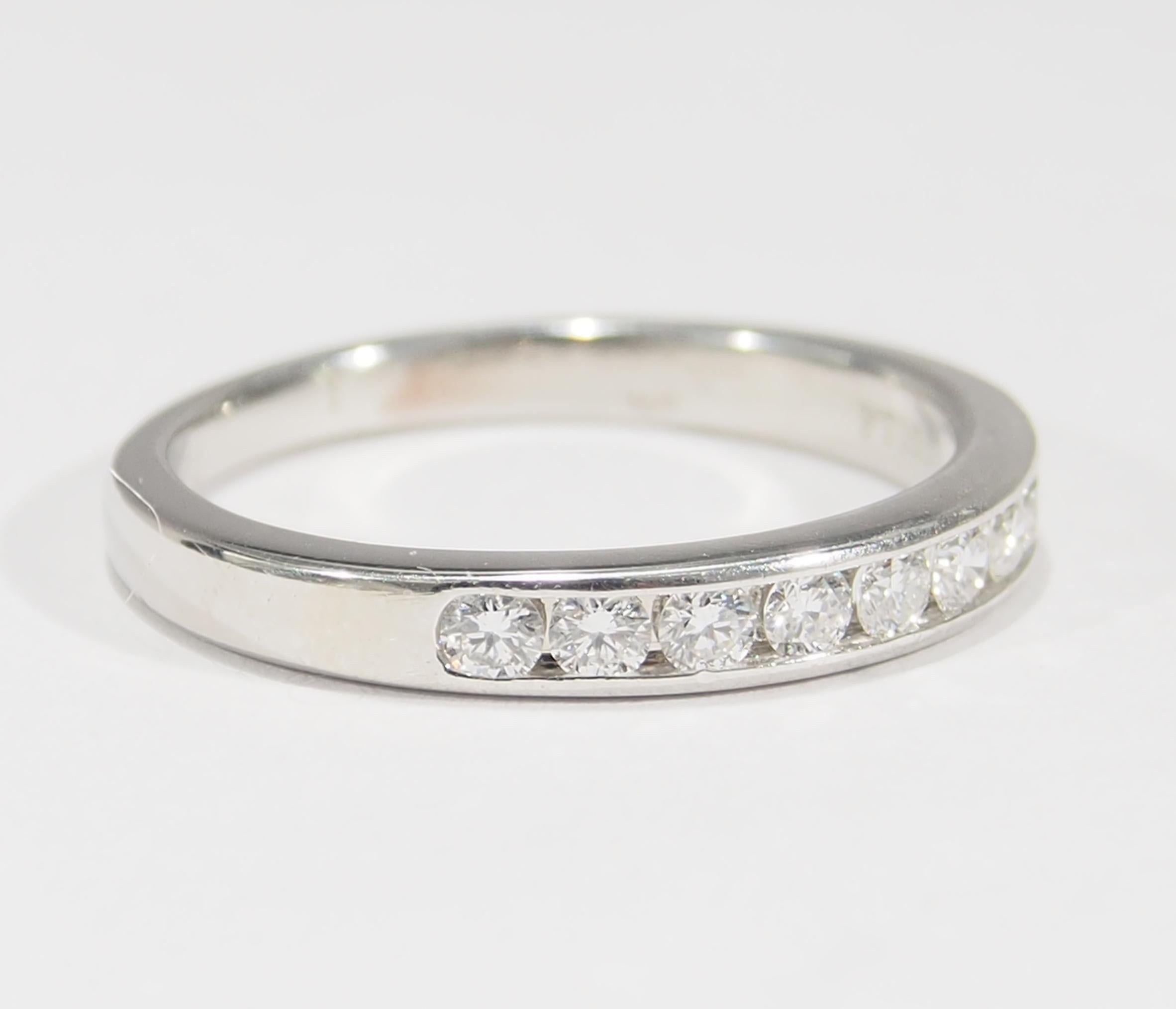 From the iconic jewelry designer, Tiffany & Company is this Platinum Diamond Band. The Ring is designed as a 
