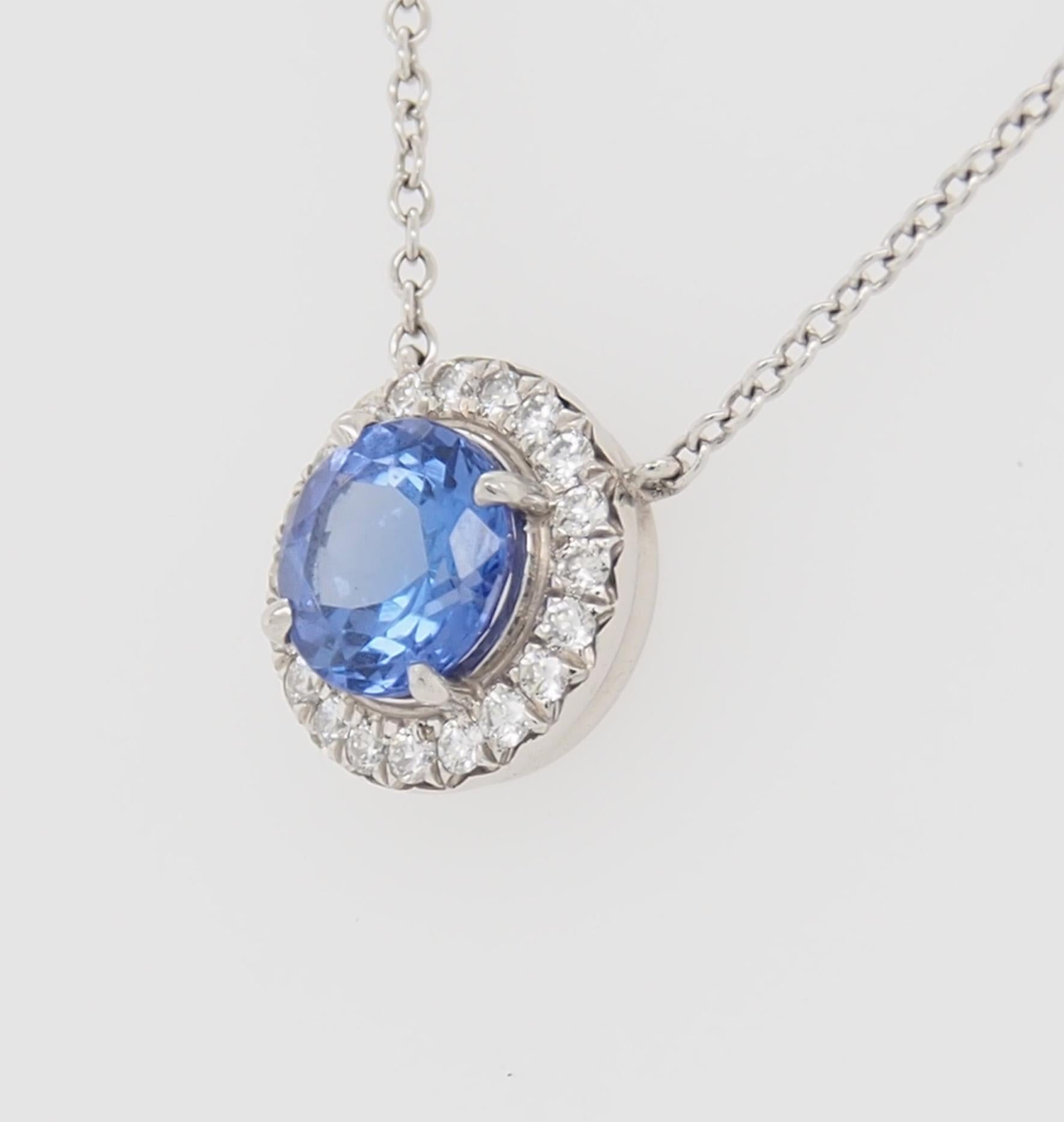 Tiffany Soleste Pendant with Round Tanzanite .70 carat total weight framed with (20) Round Brilliant Cut Diamonds .09 carat total weight, F-G in color and VS in quality. Set in Platinum on 16 inch Platinum Chain. 4.35 grams. Stamped 