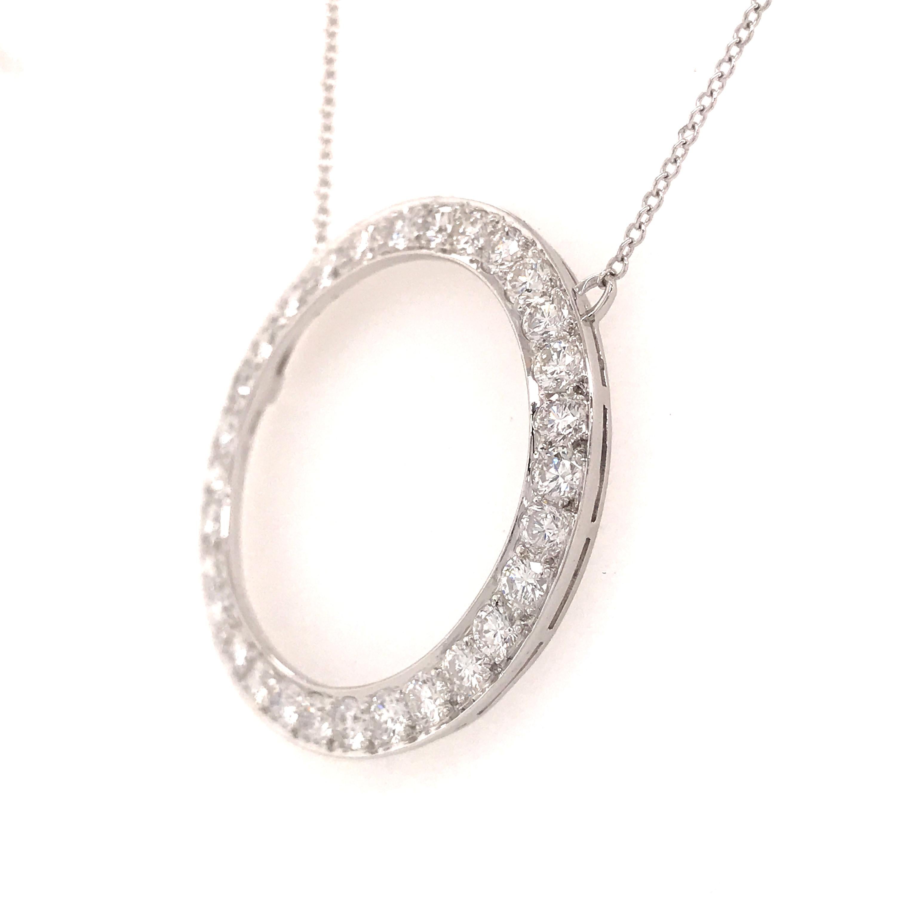 Tiffany & Co. Diamond Circle Pendant in Platinum.  (30) Round Brilliant Cut Diamonds weighing 2.0 carat total weight, F-G in color and VS in clarity are prong set in this classic piece.  The necklace measures 17 inches in length.  The Circle
