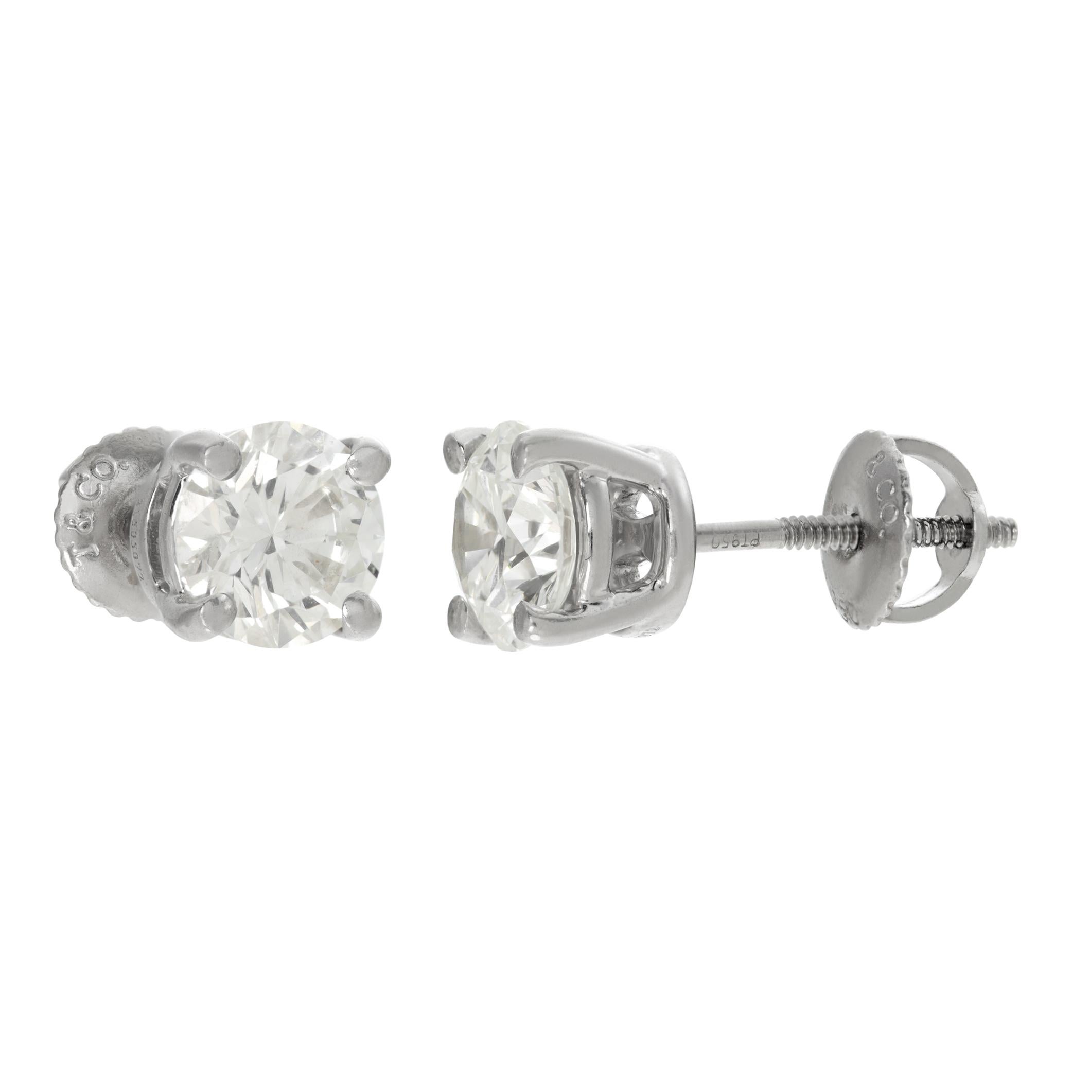 Tiffany & Co. Diamond stud earrings in platinum. 1.02 carats and 1.01 carats, G color, VS1 clarity. Comes in original Tiffany Box with Tiffany appraisal and diamond certificates.
