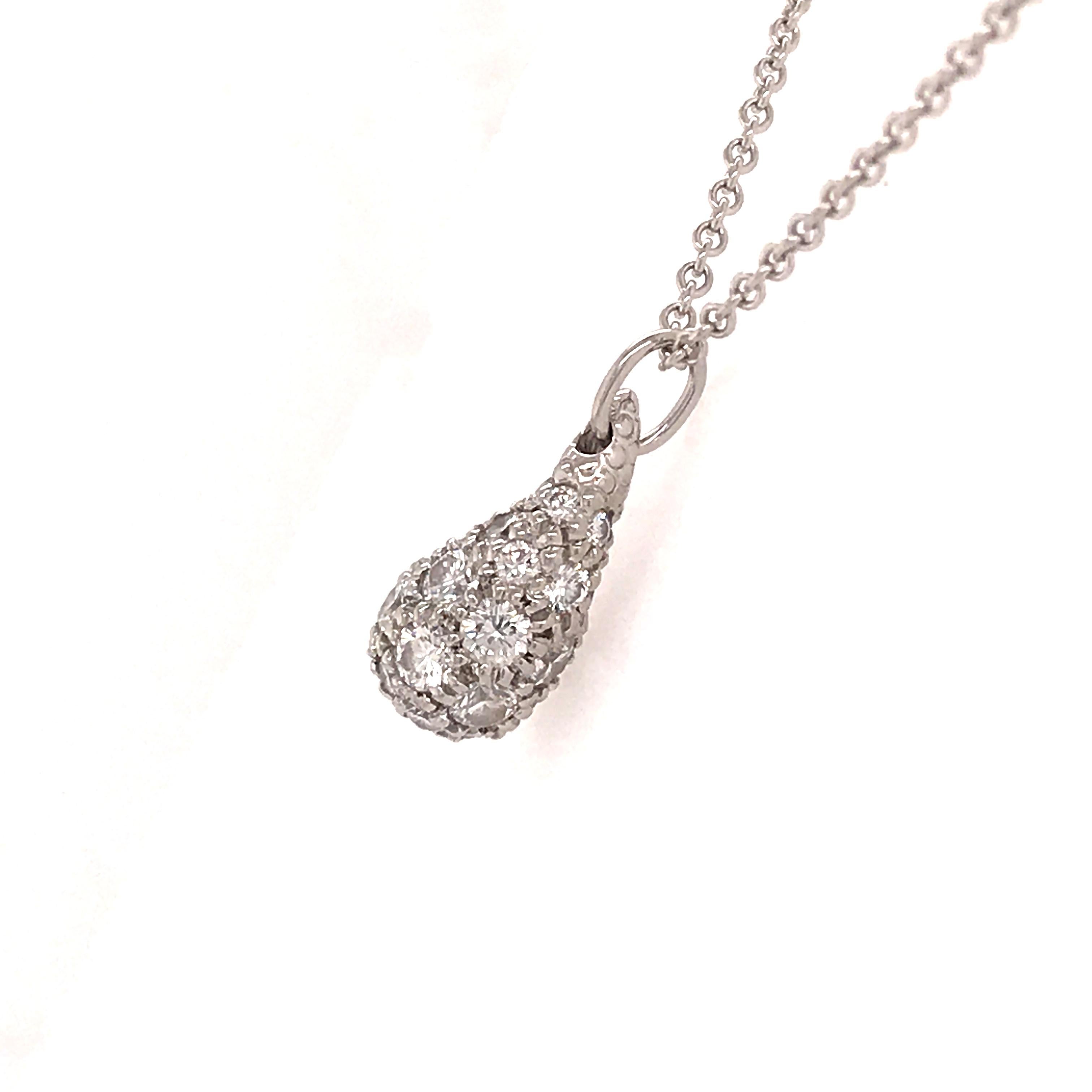 Tiffany & Co. Elsa Peretti Diamond Teardrop Necklace in Platinum. (30) Round Brilliant Cut Diamonds weighing 1.02 carat total weight, F-G in color and VS in clarity are expertly set. The Teardrop Pendant measures 1/2 inch in length, 1/4 inch in