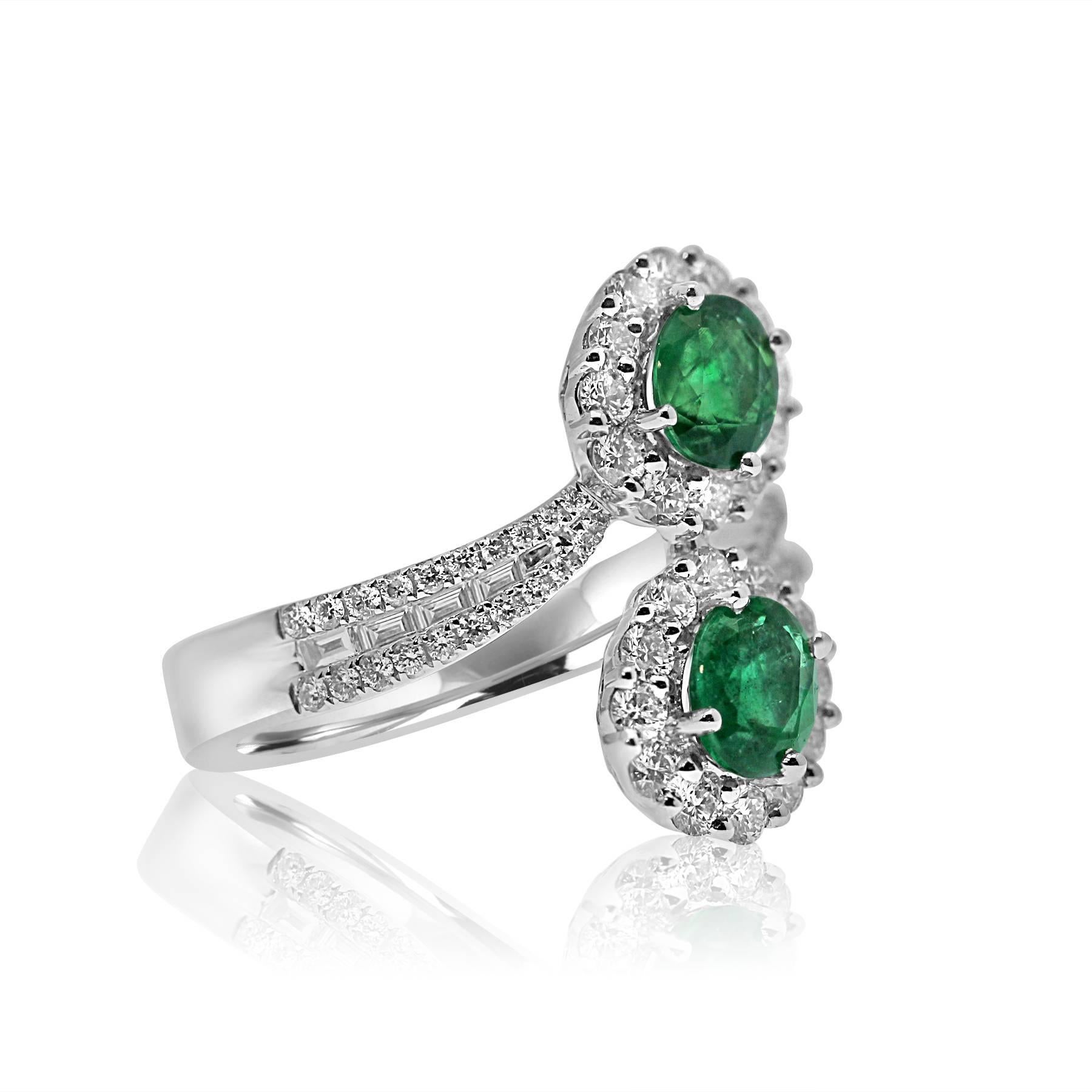 platinum  ring featuring two green emerald gemstones of 1.21ct total in a design called toi-et-moi which means me and you together forever.
surrounded by degraded brilliant and baguette cut diamonds of 1.05ct total to give an extra sparkly finish