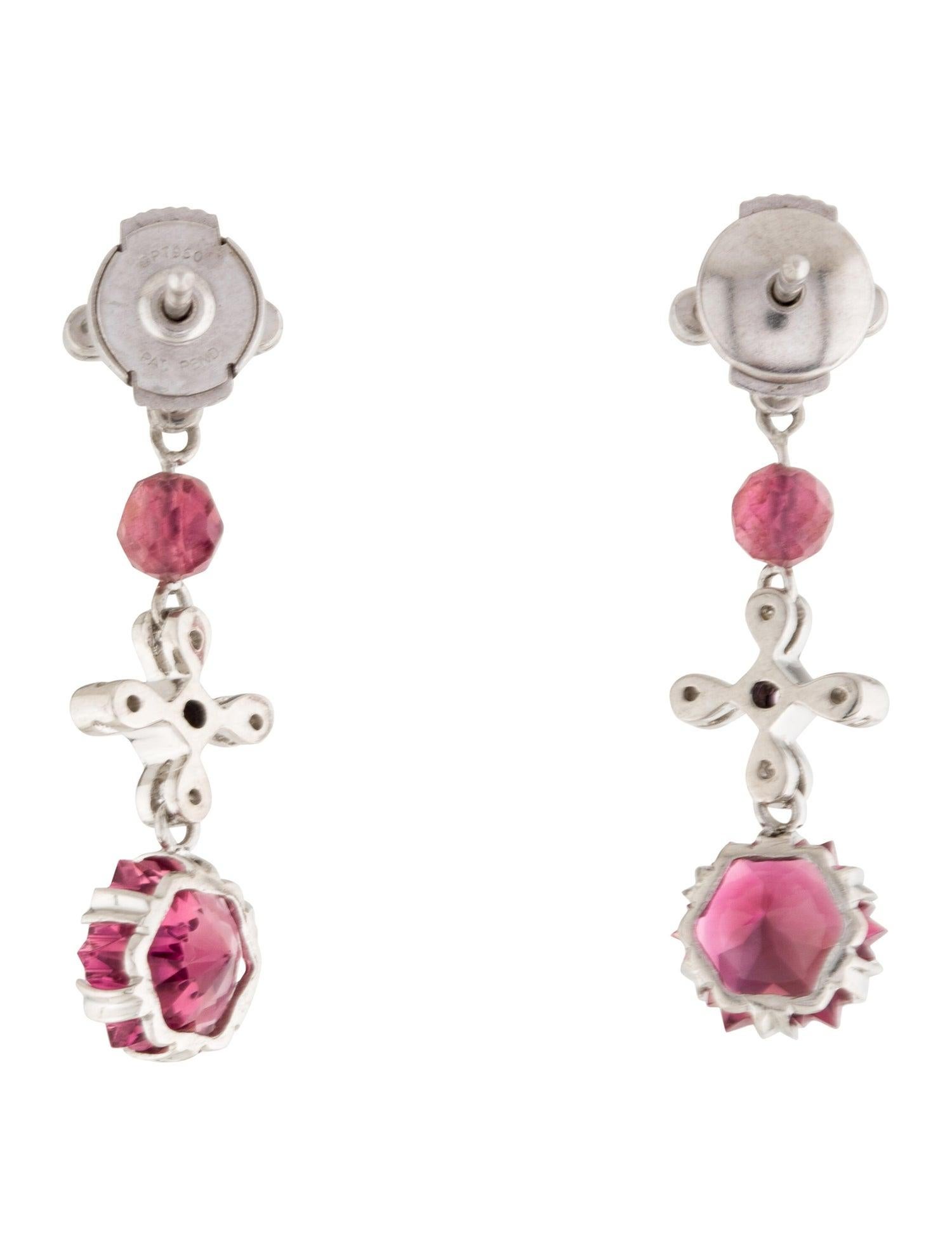 These Tourmaline and Diamond Drop Earrings are a true work of art. The snowflake faceted Tourmaline gemstones are a stunning shade of pink, and the .08cts of round brilliant diamonds add the perfect touch of sparkle. These earrings are set in