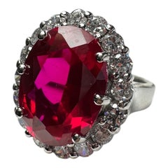 Anello da viaggio in platino con pietra rossa da 5 carati e aureola da 2,00 carati