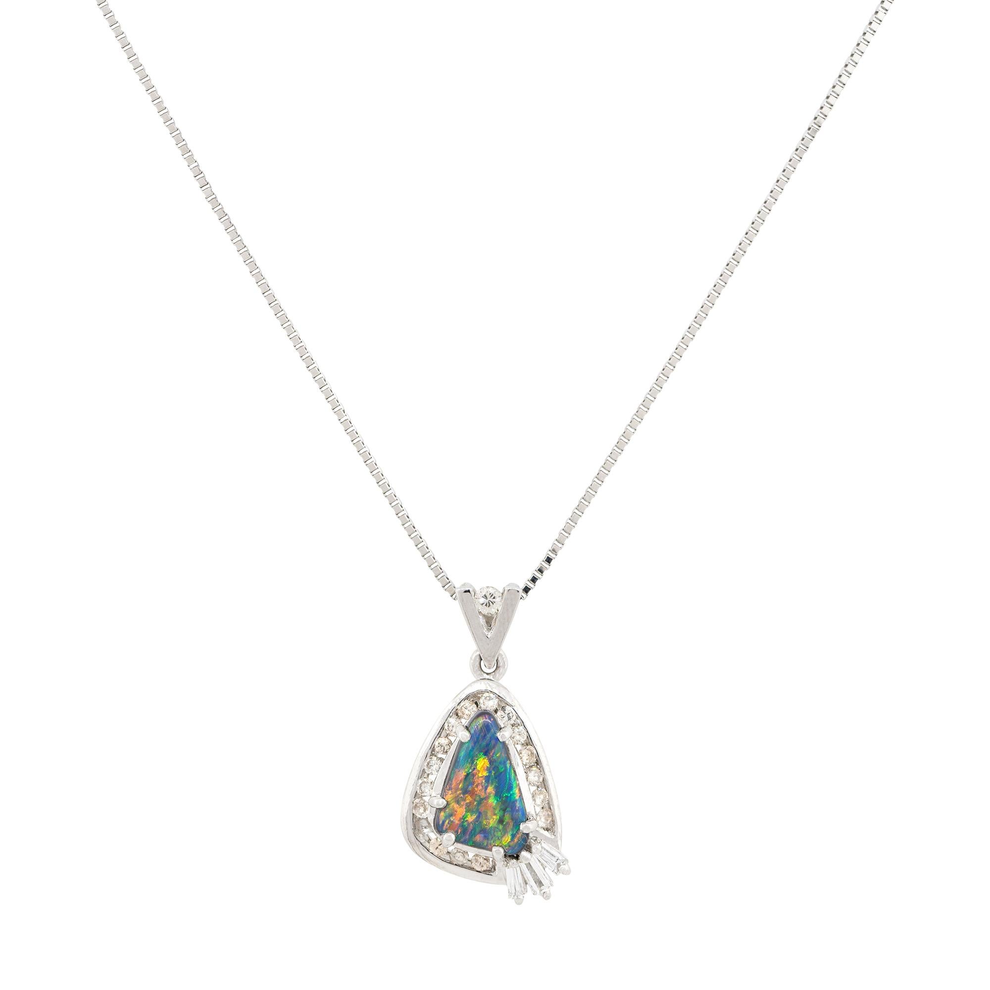 Material: Platinum
Gemstone Details: Triangle shaped Opal gemstone
Diamond Details: Round and baguette cut Diamonds. Diamonds are G/H in color and VS in clarity
Clasps: Lobster clasp
Total Weight: 6.6g (4.3dwt) 
Pendant measurements: 1.2
