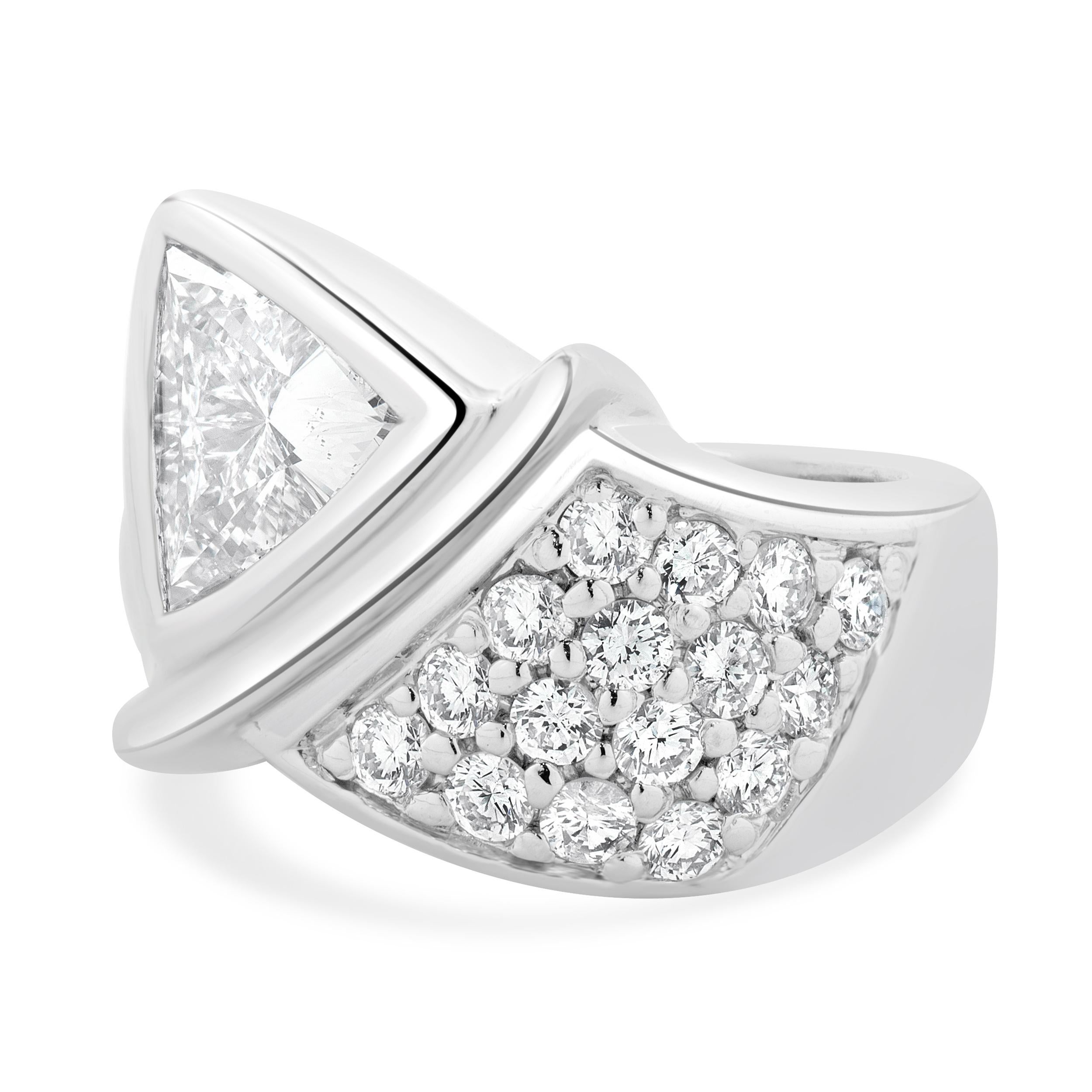 Designer: Custom
Material: Platinum
Diamond: 1 trillion cut = 1.55ct
Color: H
Clarity: SI2
Diamond: 16 round brilliant cut = 0.64cttw
Color: G
Clarity: SI1-2
Dimensions: ring top measures 16.5mm wide
Ring Size: 6.25 (complimentary sizing