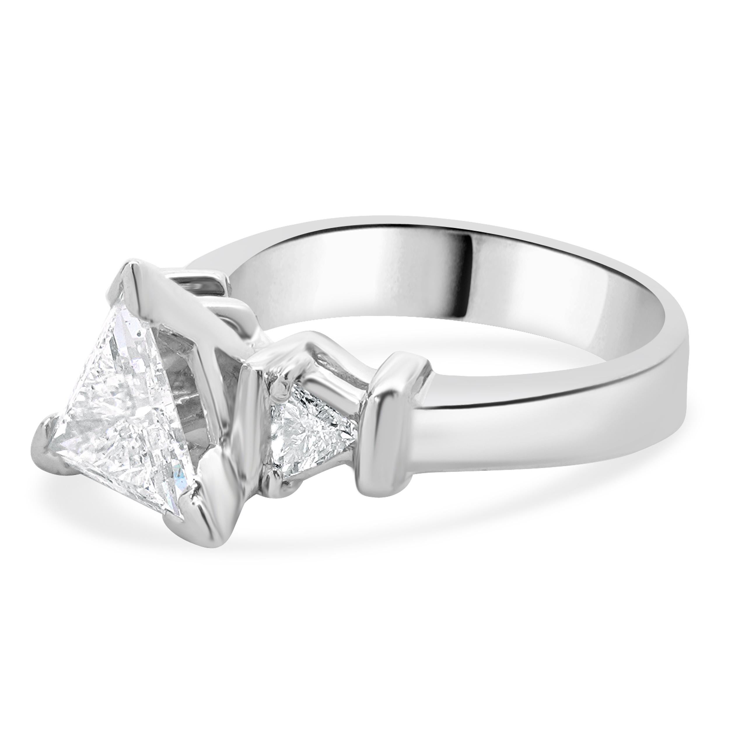 Designer: custom
Material: platinum
Diamond: 1 trillion cut = 1.19ct
Color: G
Clarity: SI2
Diamonds: 2 trillion cut= 0.26cttw
Color: H/I
Clarity: SI2
Ring Size: 6 (please allow two additional shipping days for sizing requests)
Dimensions: ring top