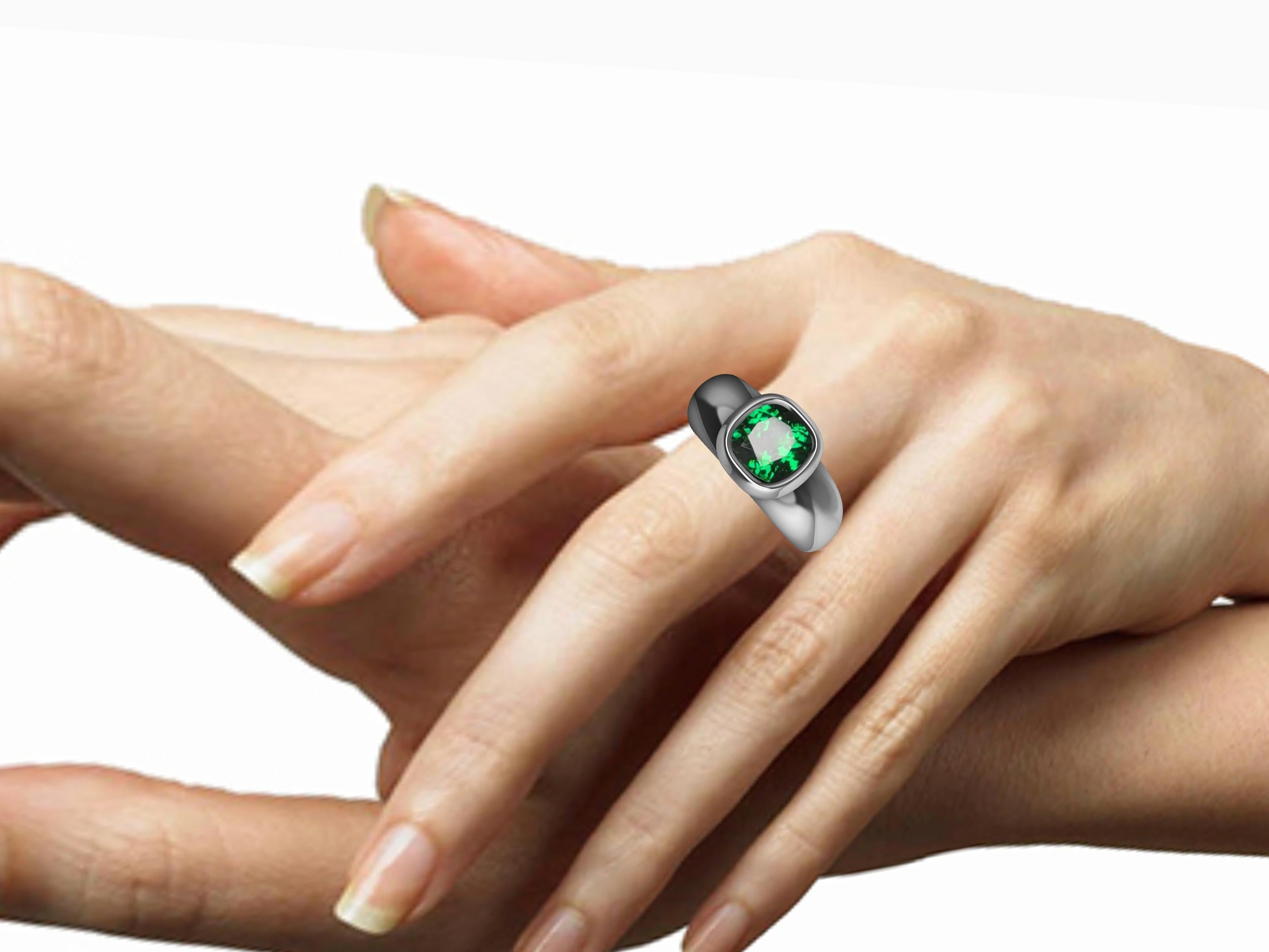Platinum Tsavorite Sculpture Ring, Tiffany Designer, Thomas Kurilla is keeping it simple. This idea of simplifying your life can go into a lifestyle of design also. 7 X 7 mm cushion cut tsavorite in bezel setting. Call it  a fashion ring or a