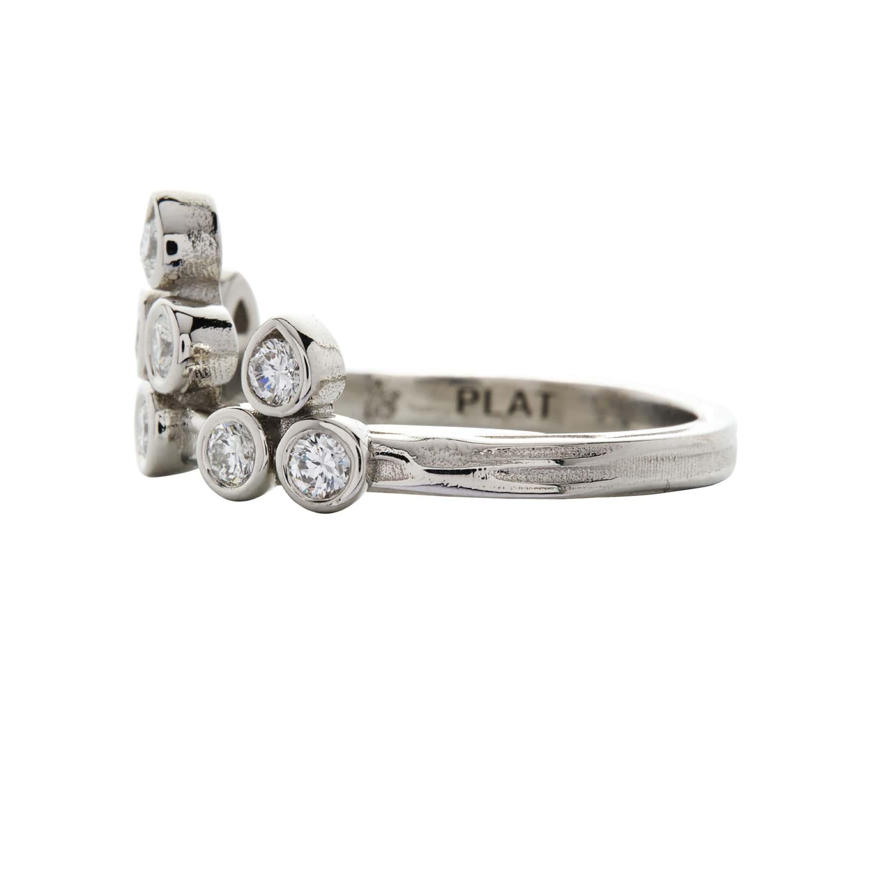 Created in luxurious platinum, a tiara-like configuration is formed by 10 bezel-set round brilliant diamonds. The top 3 settings are pear-shaped with their points facing upward. This ring can be worn alone or stacked, and in either direction on the