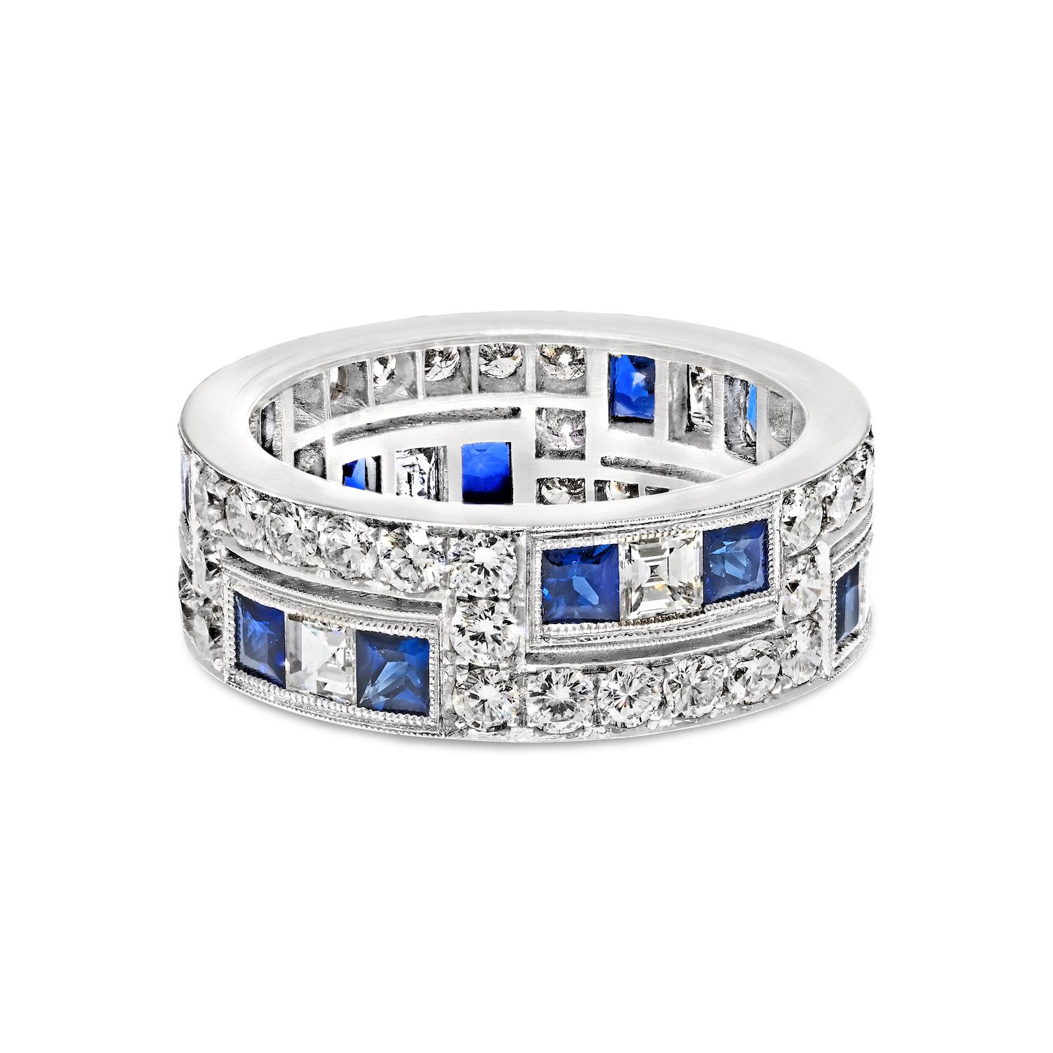 Our workshop is proud to offer a stunning custom-made eternity ring that is crafted from the finest materials.

This exquisite ring is made from platinum and features a dazzling array of diamonds and sapphires.

The band itself is predominantly made
