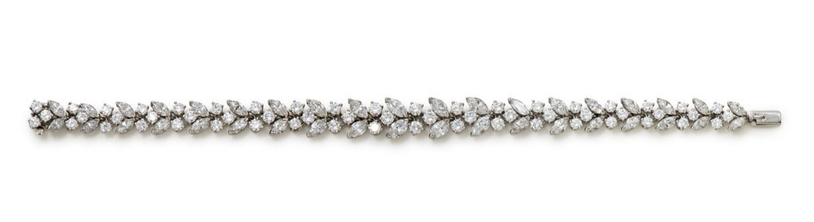 One of the most exquisite diamond bracelets we have owned recently! Made by Van Cleef and Arpels in the 1960's, the platinum bracelet features 95 marquise and round brilliant cut diamonds set in a line and graduating out from the center in either