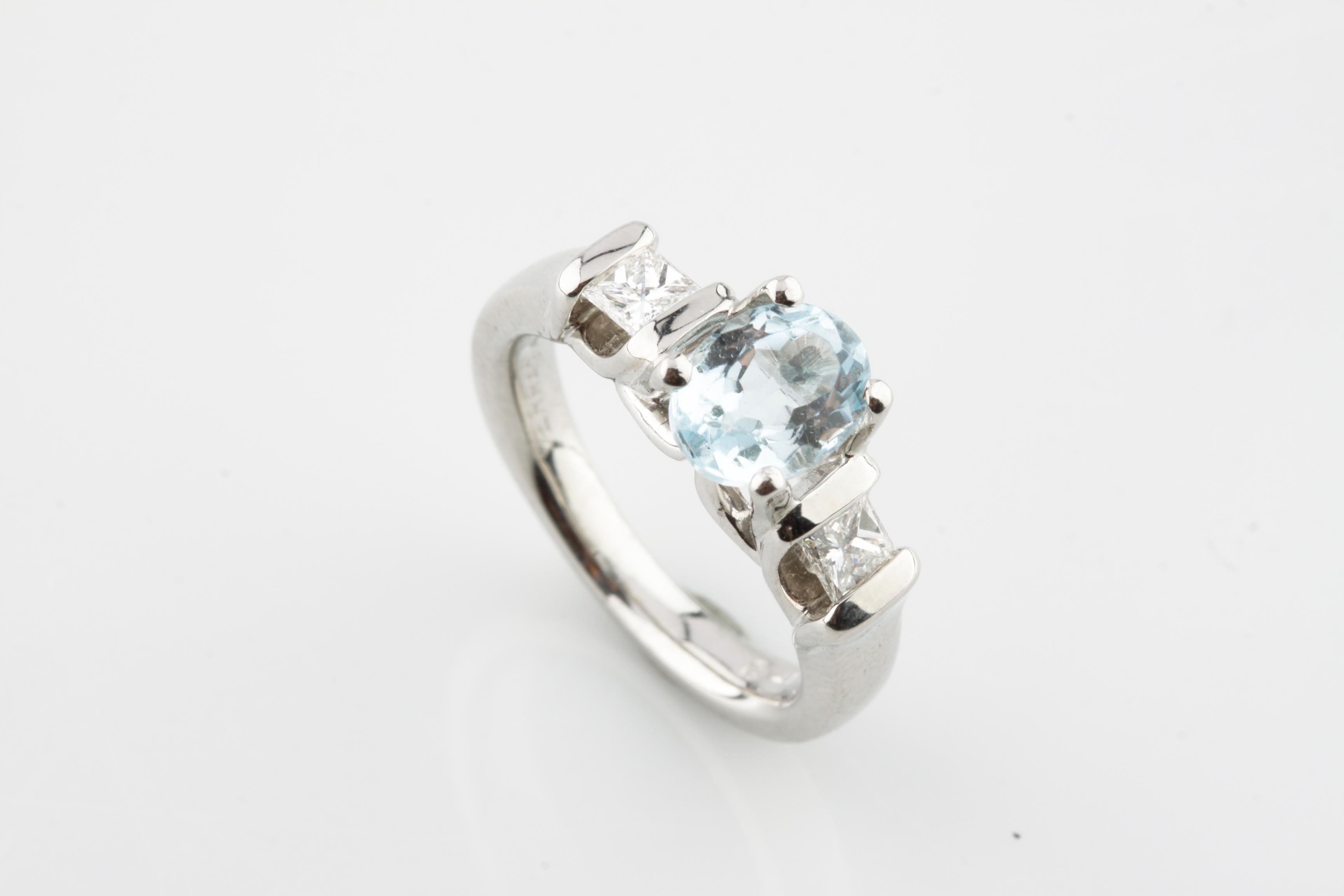 One Electronically tested platinum ladies cast blue topaz& diamond ring with  bright finish. Condition is good. Trademark is VERRAGIO. Identified with the marking of 