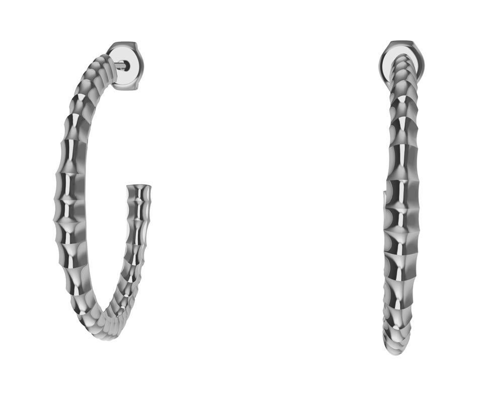 Platinum Vetebrae Hoop Earrings  Tiffany designer , Thoms Kurilla will take even an injury and subconsciously create something out of it. Don't bend your back like these hoops, unless you are a trained gymnist or acrobat. Concaves accenting the oval