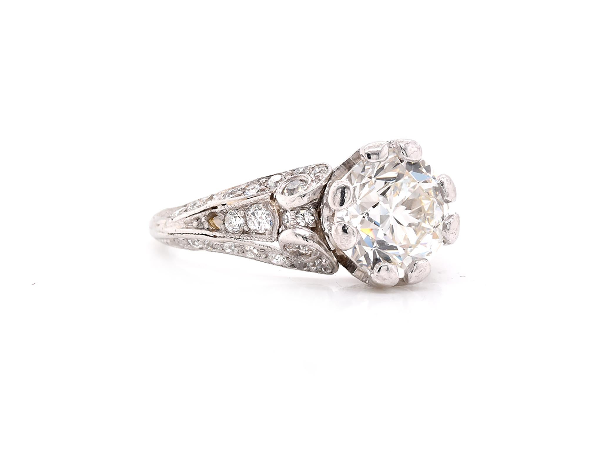 Platinum Vintage Art Deco Style Diamond Engagement Ring
 
Material: platinum
Center Diamond: 1 round European cut = 2.10ct
Color: H
Clarity: SI1
Diamonds: 40 round cut = .50cttw
Color: H
Clarity:  SI1
Ring Size: 7 (please allow up to 2 additional