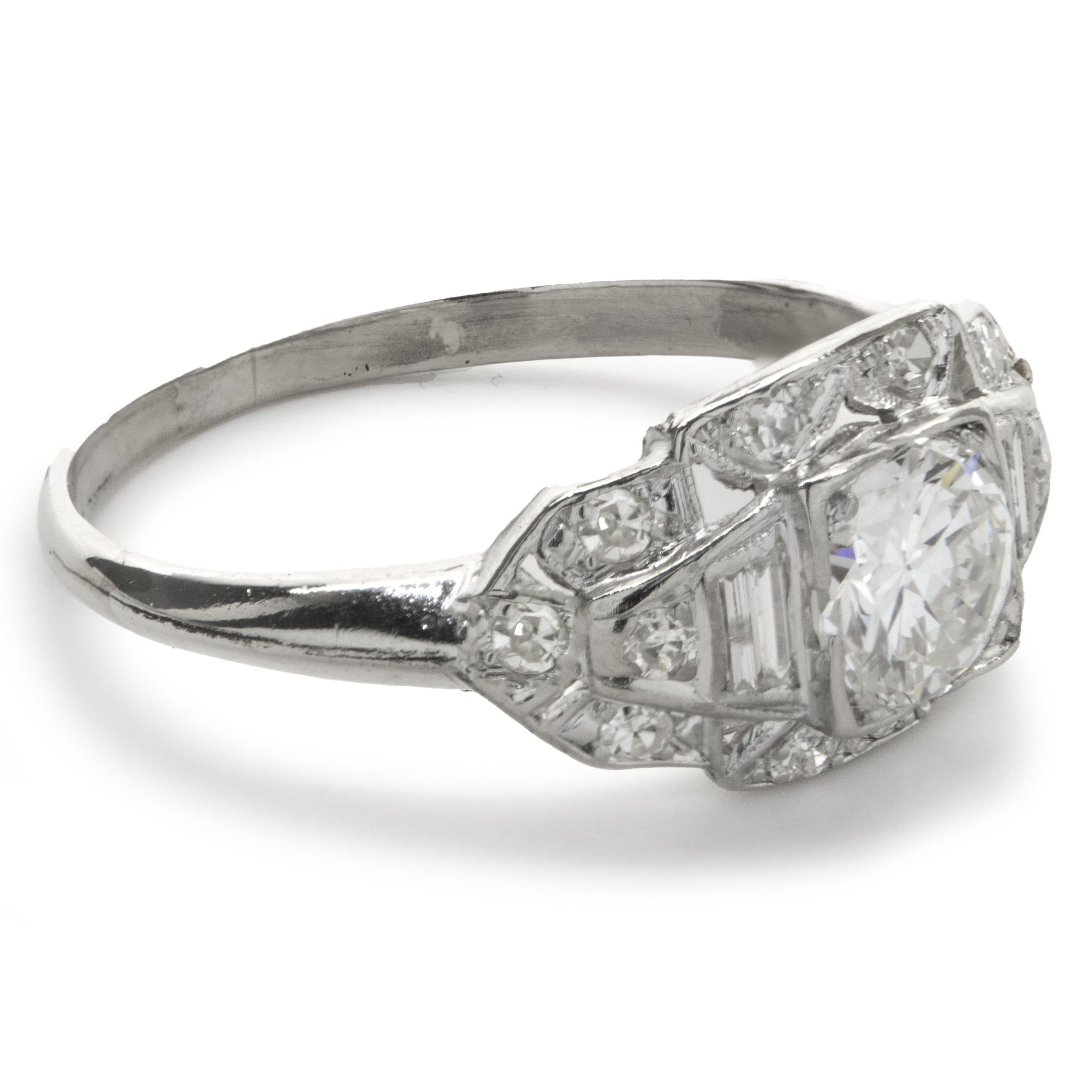 Designer: custom
Material: Platinum
Diamond: 1 round European cut = .70ct
Color: F
Clarity: SI1
Diamond: 14 round and baguette cut = .25cttw
Color: G
Clarity: SI1
Ring size: 7 (please allow two additional shipping days for sizing requests)
Weight: 