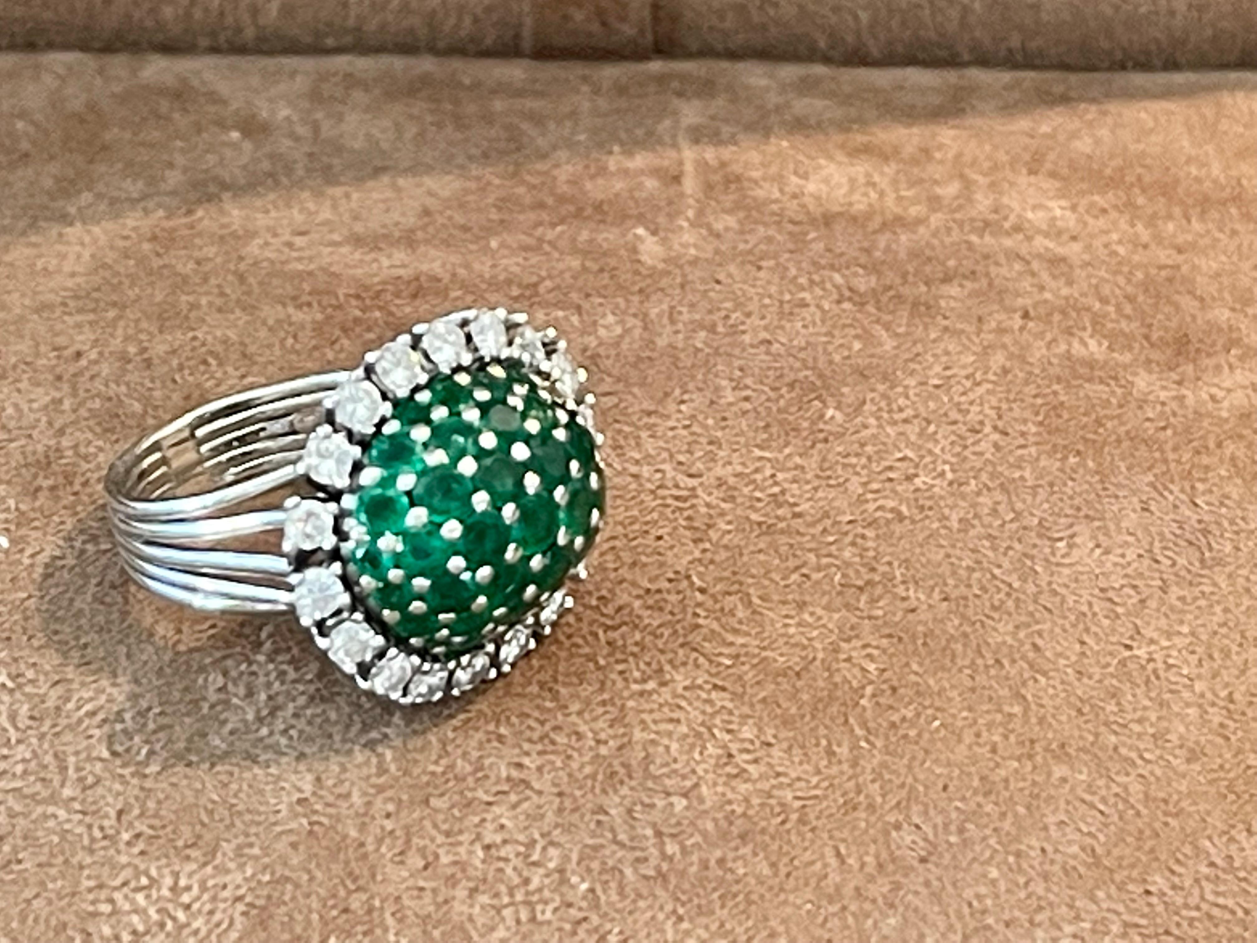 Lovely Platinum Vintage Ring featruing 30 brilliant cut Emeralds weighing approximately 2.50 ct in a surrounding of 18 brilliant cut Diamonds weighing approximately 0.80 ct, G color, vs clarity. 
The ring is currently size 51/11( american Ring size