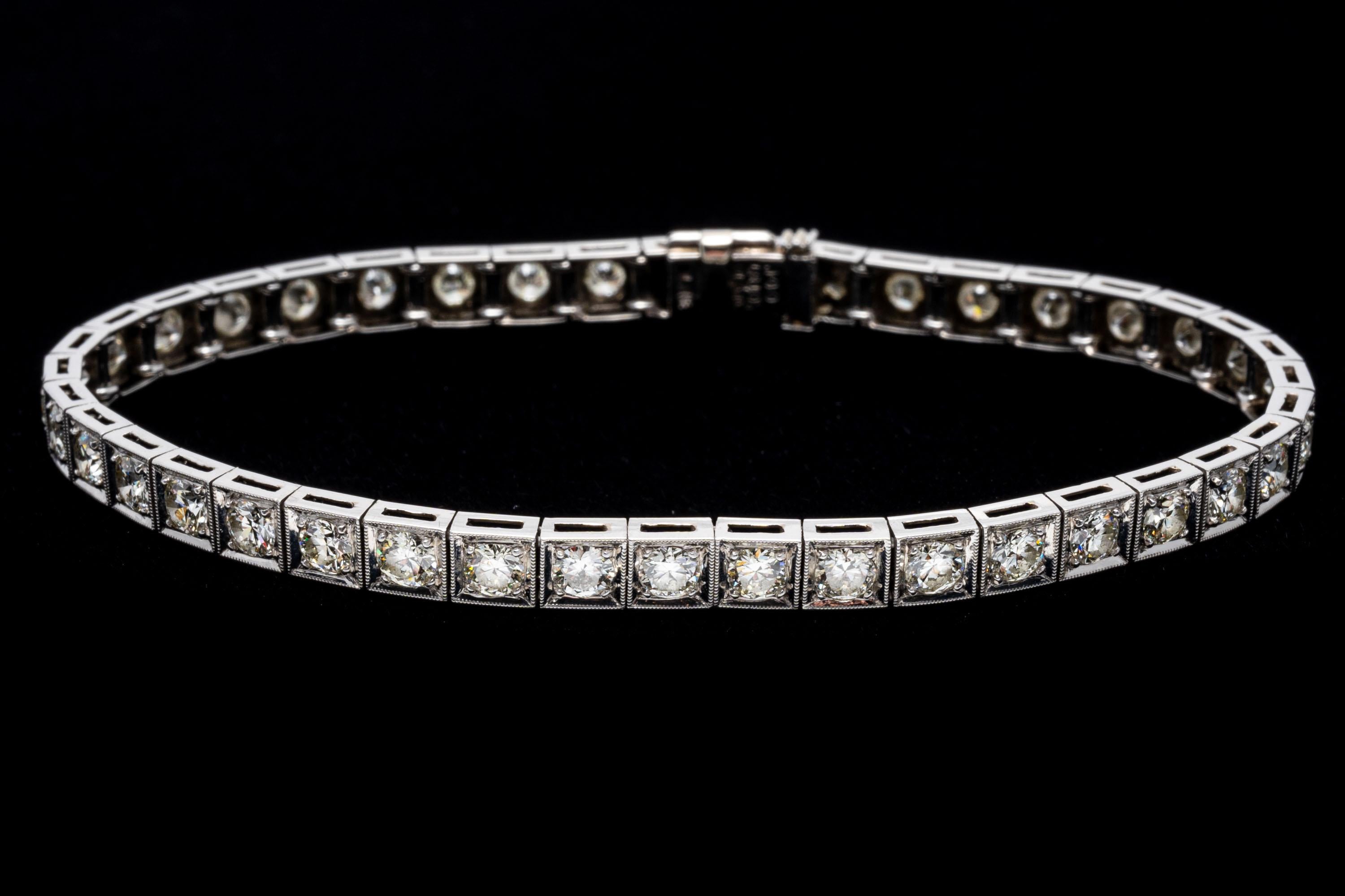 Platinum line bracelet. This marvelous vintage platinum diamond line bracelet features round faceted, European cut diamonds, approximately 3.72 TCW, ranging in clarity from VS2 to Si2, and are J to K color. The stones are prong set into square
