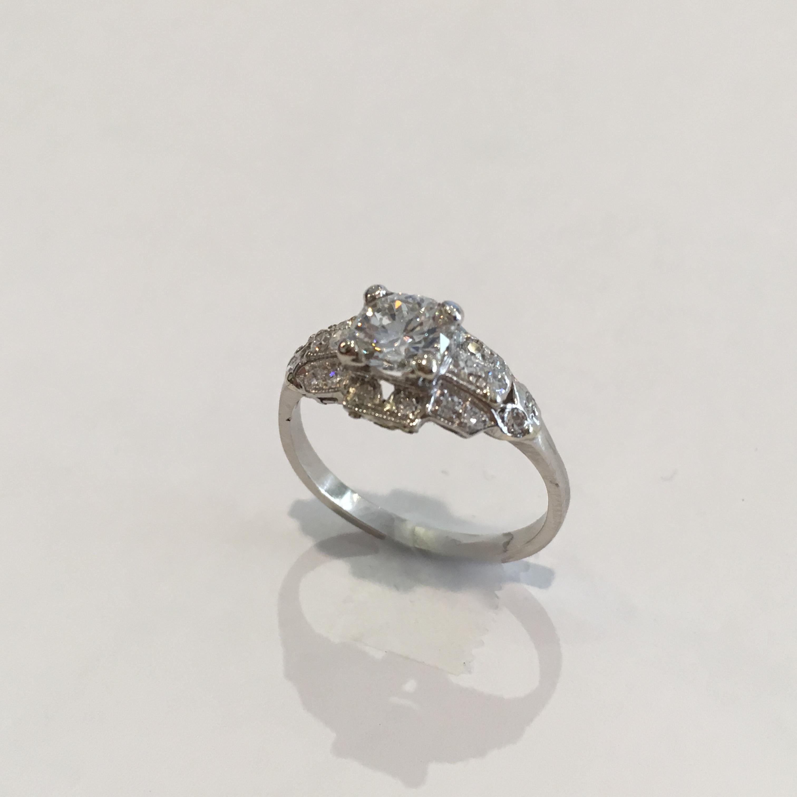 Ladies vintage platinum diamond ring.
Tests platinum and weighs 3.6 grams.
The center diamond is a round brilliant cut, .76 carats, F color, VS2 clarity, good cut, GIA grading certificate # 2185812582.
The side diamonds are round, single-cuts, .32