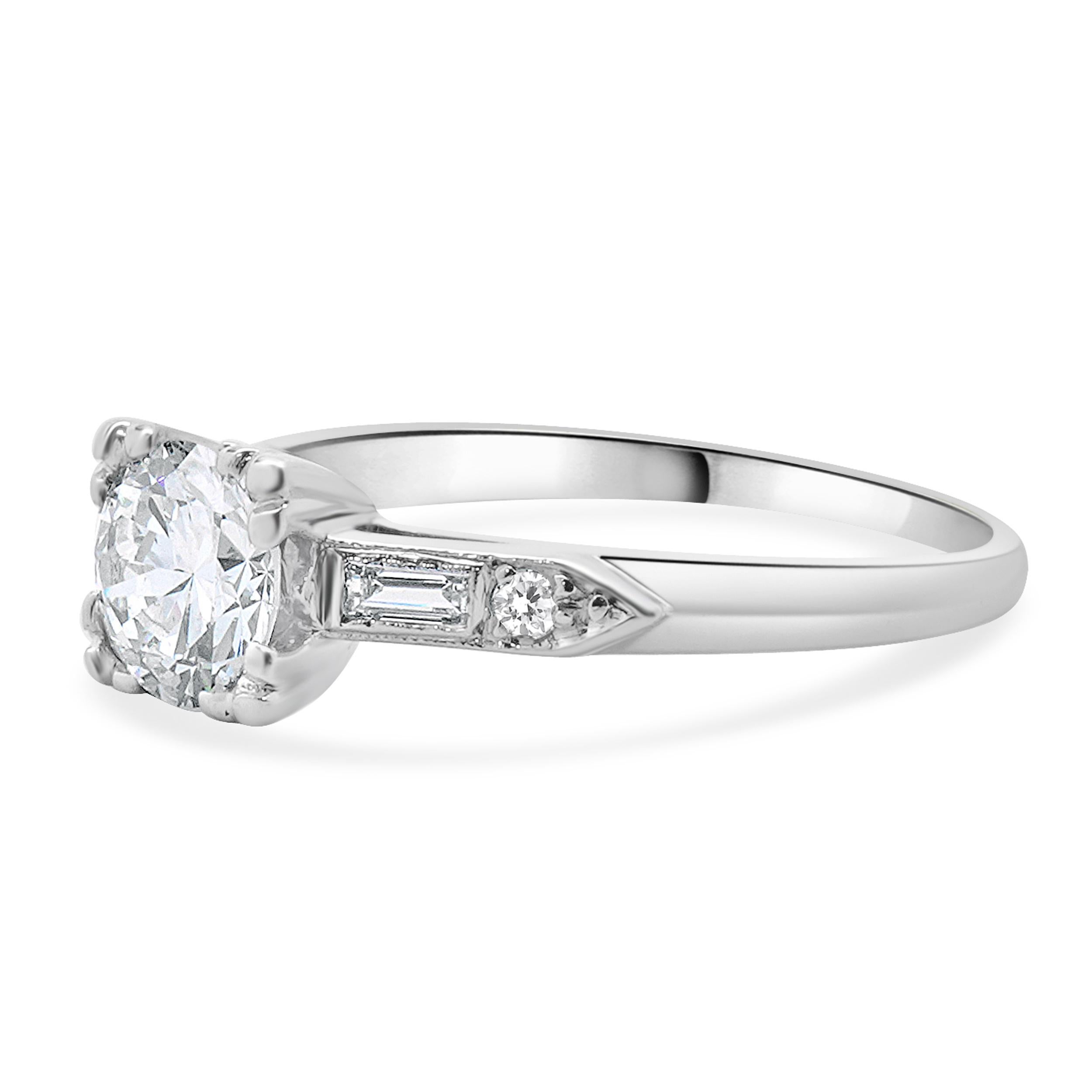 Designer: custom
Material: platinum
Diamond:  1 round european cut = 0.50ct
Color: H
Clarity: SI1
Diamond:  4 old mine cut = 0.12ct
Color: H
Clarity: SI1
Dimensions: ring top measures 5.6mm wide
Ring Size: 5.5 (complimentary sizing