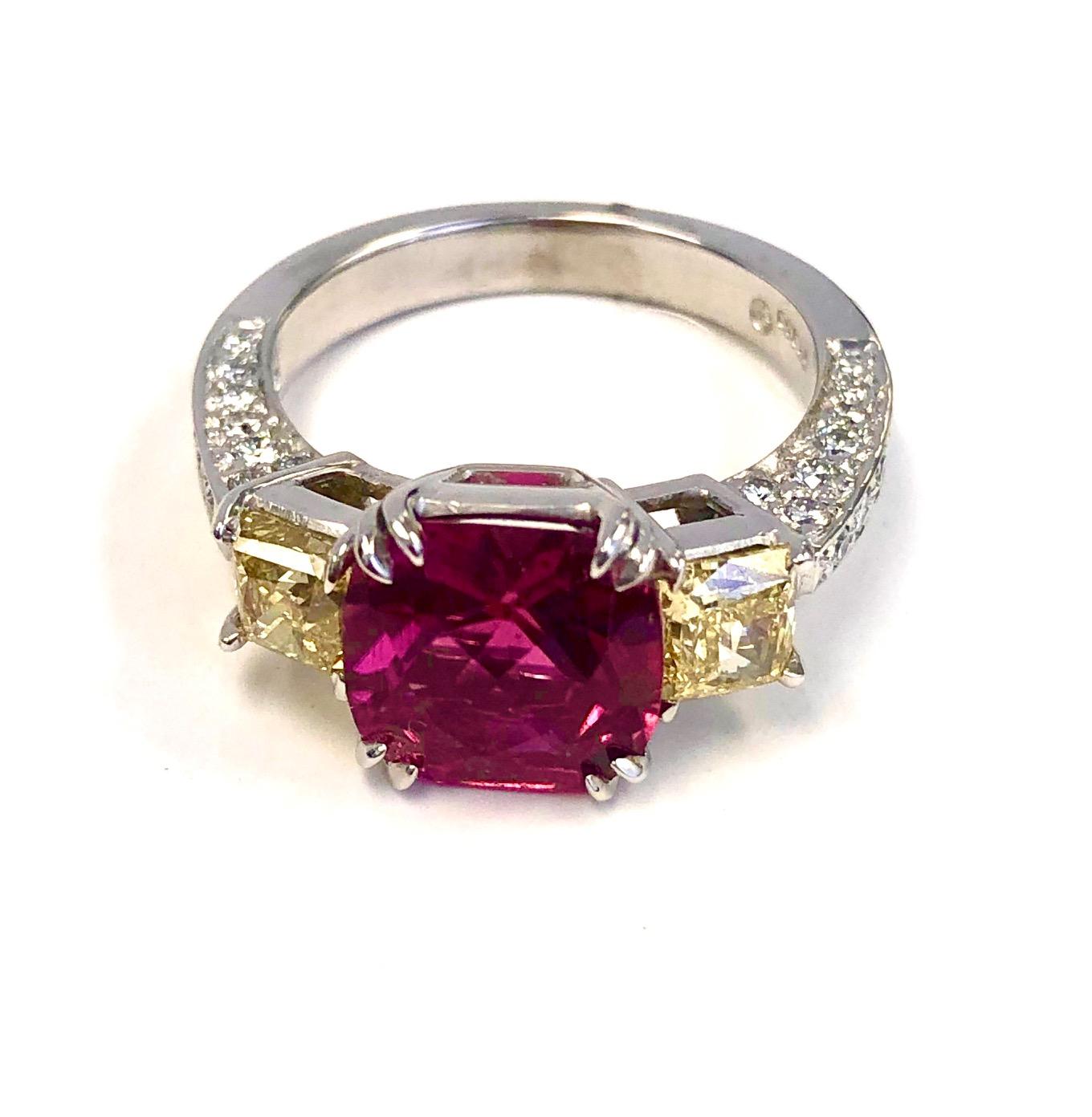 A very elegant Ring design, set with 38 round Diamonds 0.58 carats, 2 Vivid Yellow Diamonds 1.06 carats and a perfect Pink Tourmaline 2.55 carats.

We design and manufacture our jewelry in our workshop, located in New York City's diamond district.