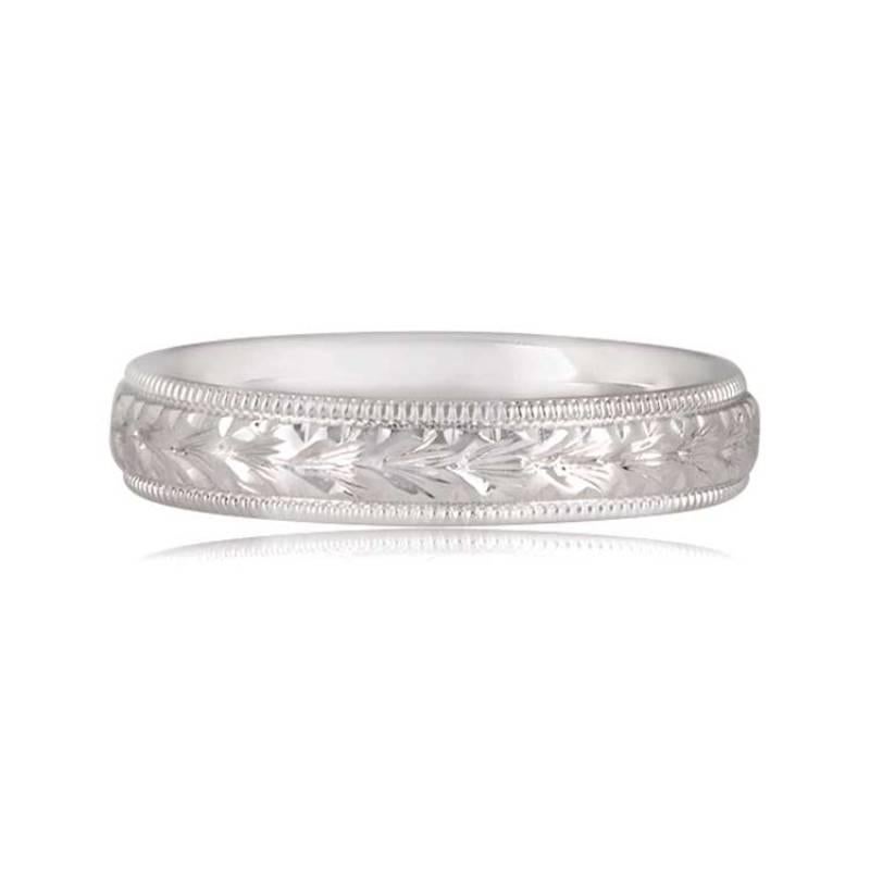 Indulge in the charm of this exquisite Art Deco-inspired wedding band meticulously handcrafted in platinum. The band is adorned with intricate hand engravings and delicate fine milgrain detailing, creating a stunning vintage aesthetic.

Ring Size: 7