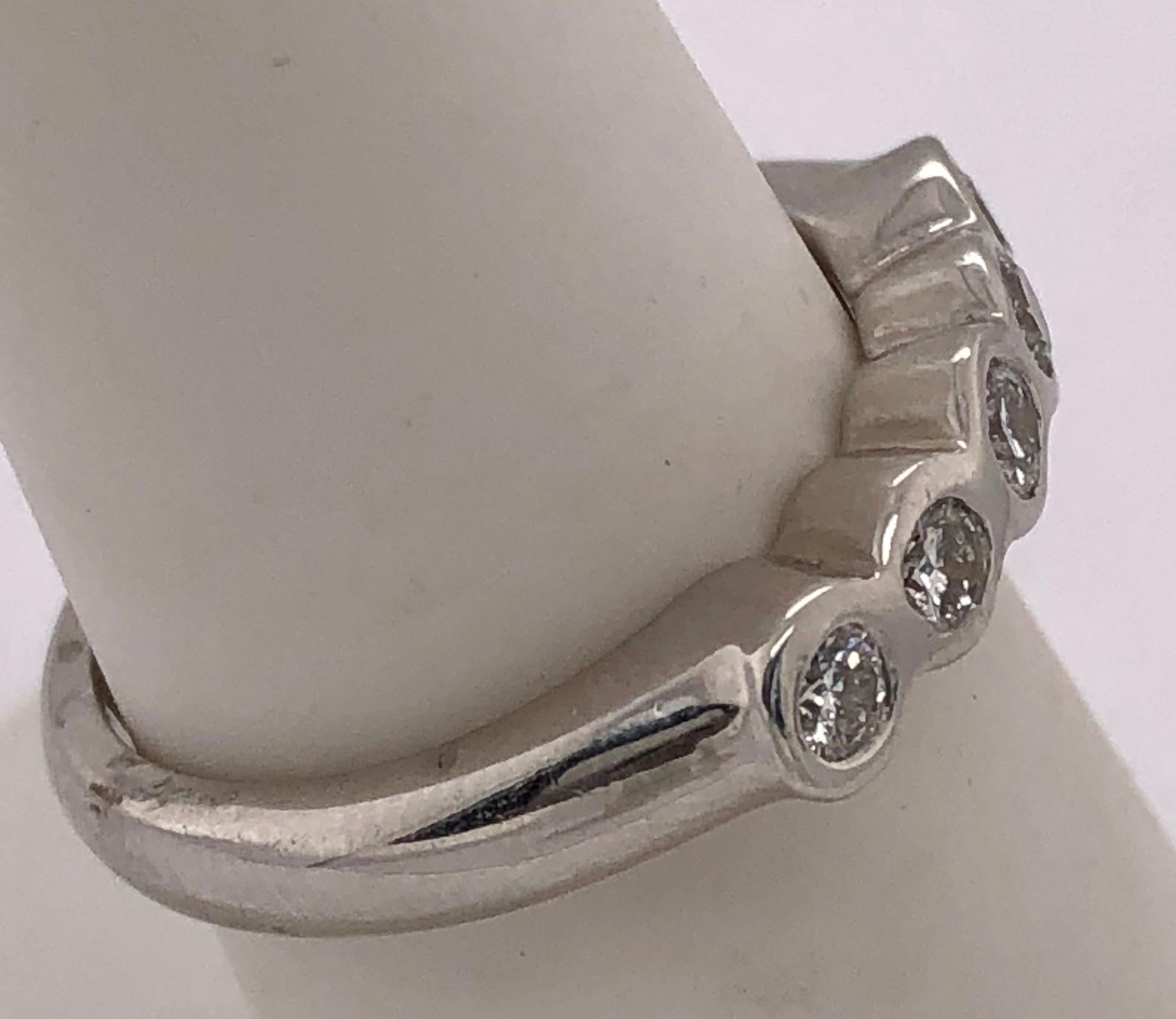 Platinum Wedding Band with Five Round Diamonds .50 Total Diamond Weight In Good Condition For Sale In Stamford, CT